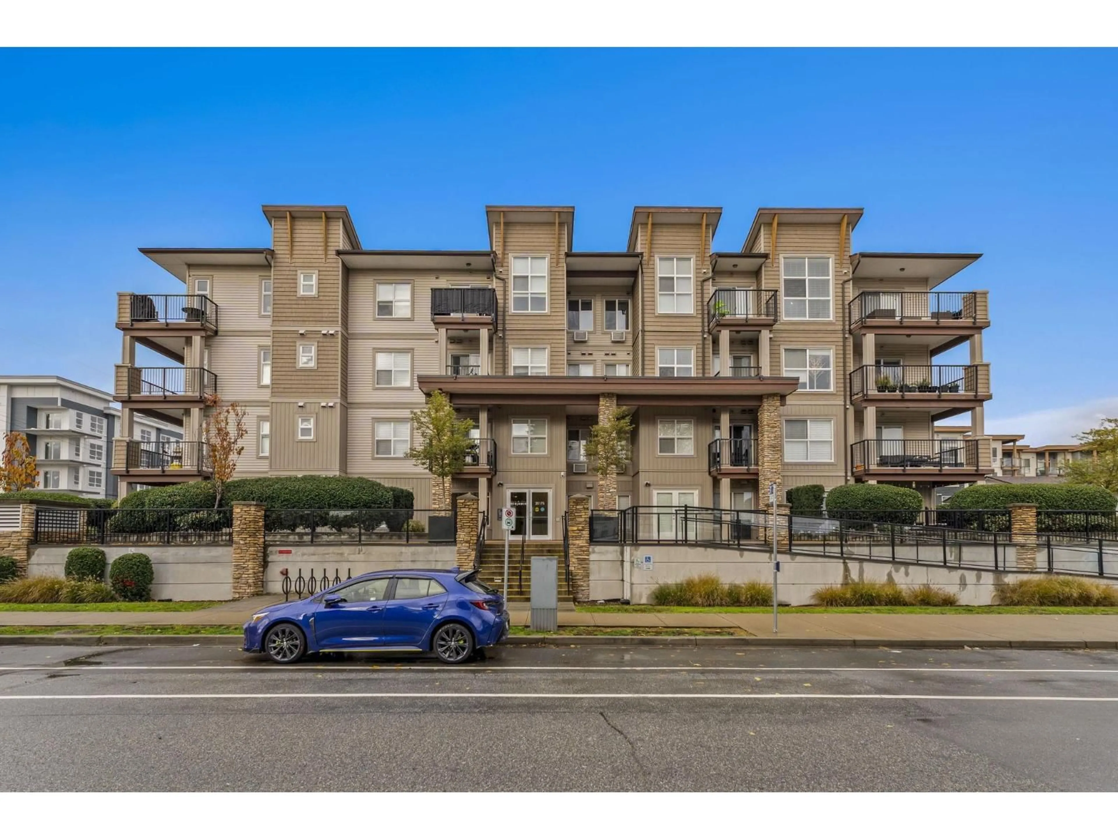 A pic from outside/outdoor area/front of a property/back of a property/a pic from drone, street for 106 - 20175 53, Langley British Columbia V3A0J8