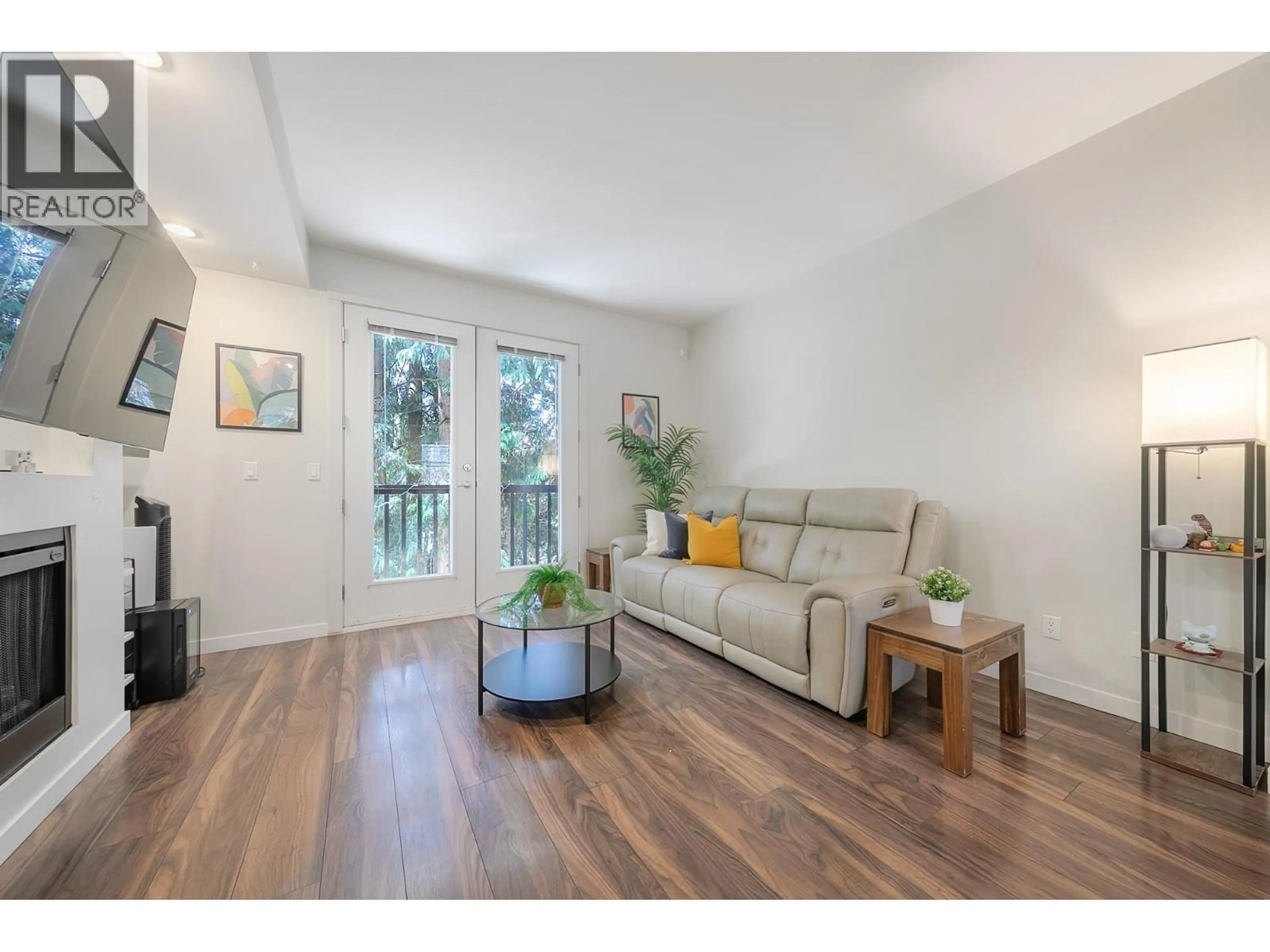 Living room with furniture, wood/laminate floor for 82 - 688 EDGAR AVENUE, Coquitlam British Columbia V3K0A5