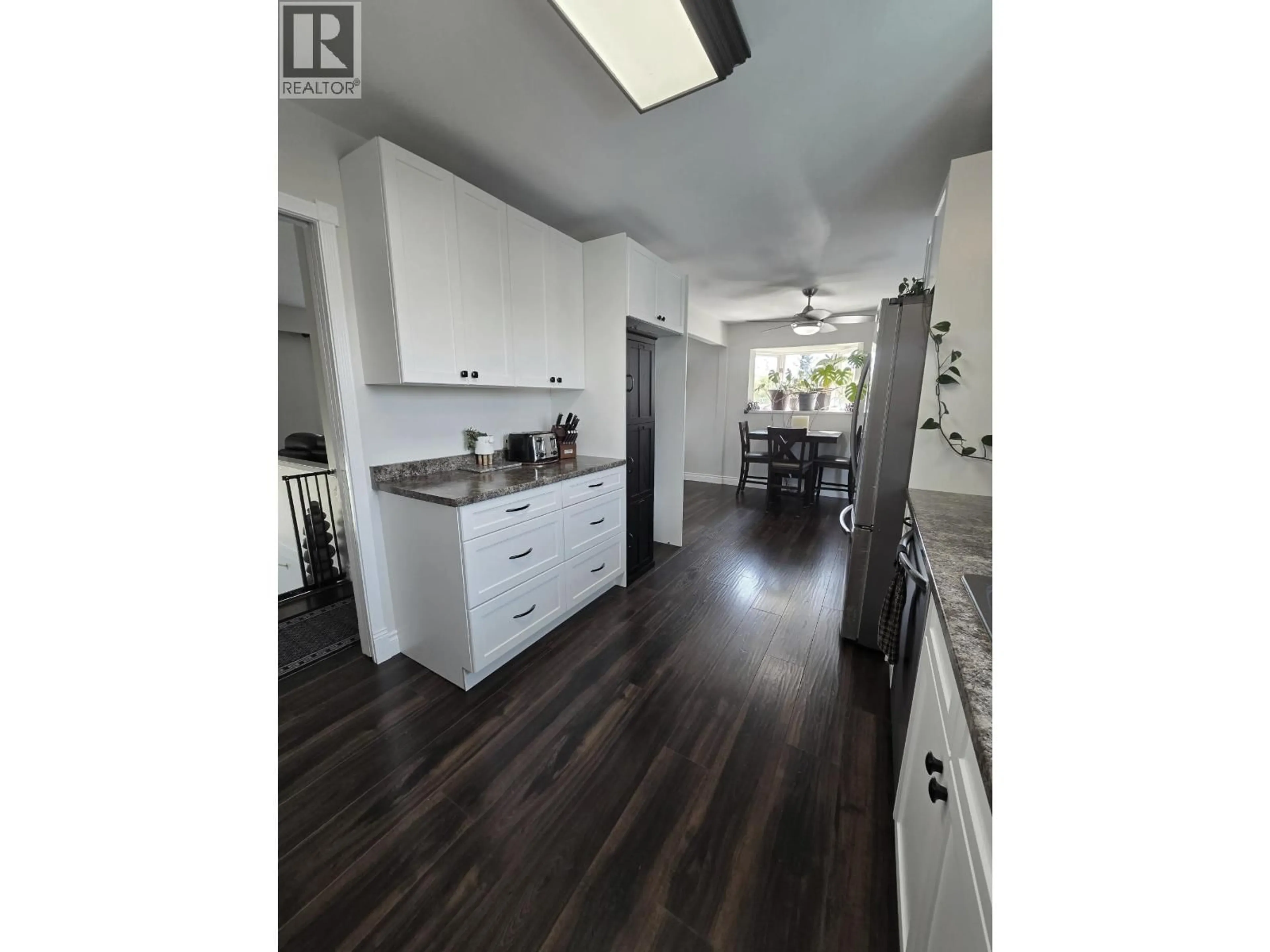 Open concept kitchen, wood/laminate floor for 10604 92 STREET, Fort St. John British Columbia V1J3J3