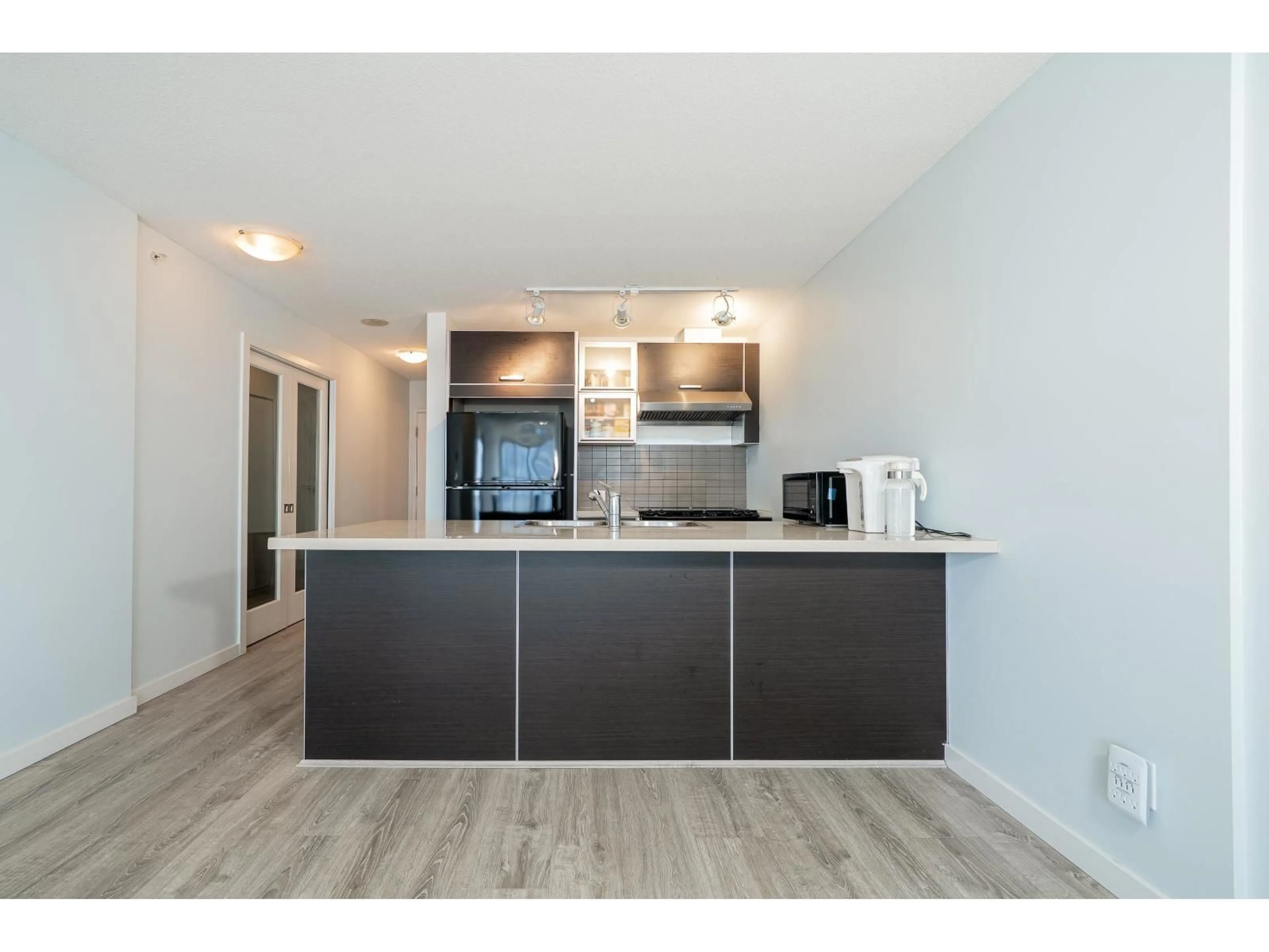 Open concept kitchen, wood/laminate floor for 2303 - 13688 100, Surrey British Columbia V3T0G5