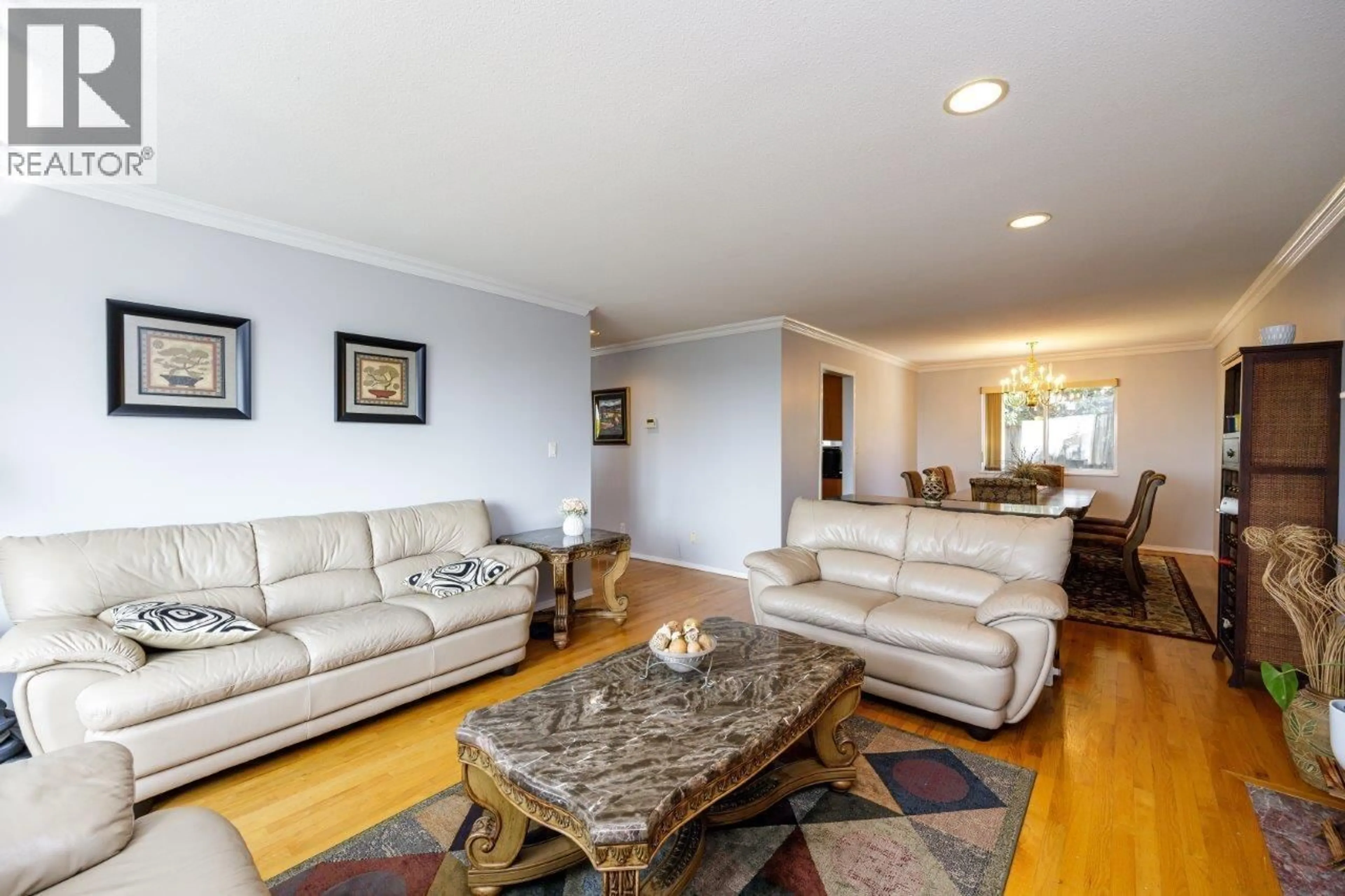 Living room with furniture, wood/laminate floor for 4549 PORTLAND STREET, Burnaby British Columbia V5J2P1
