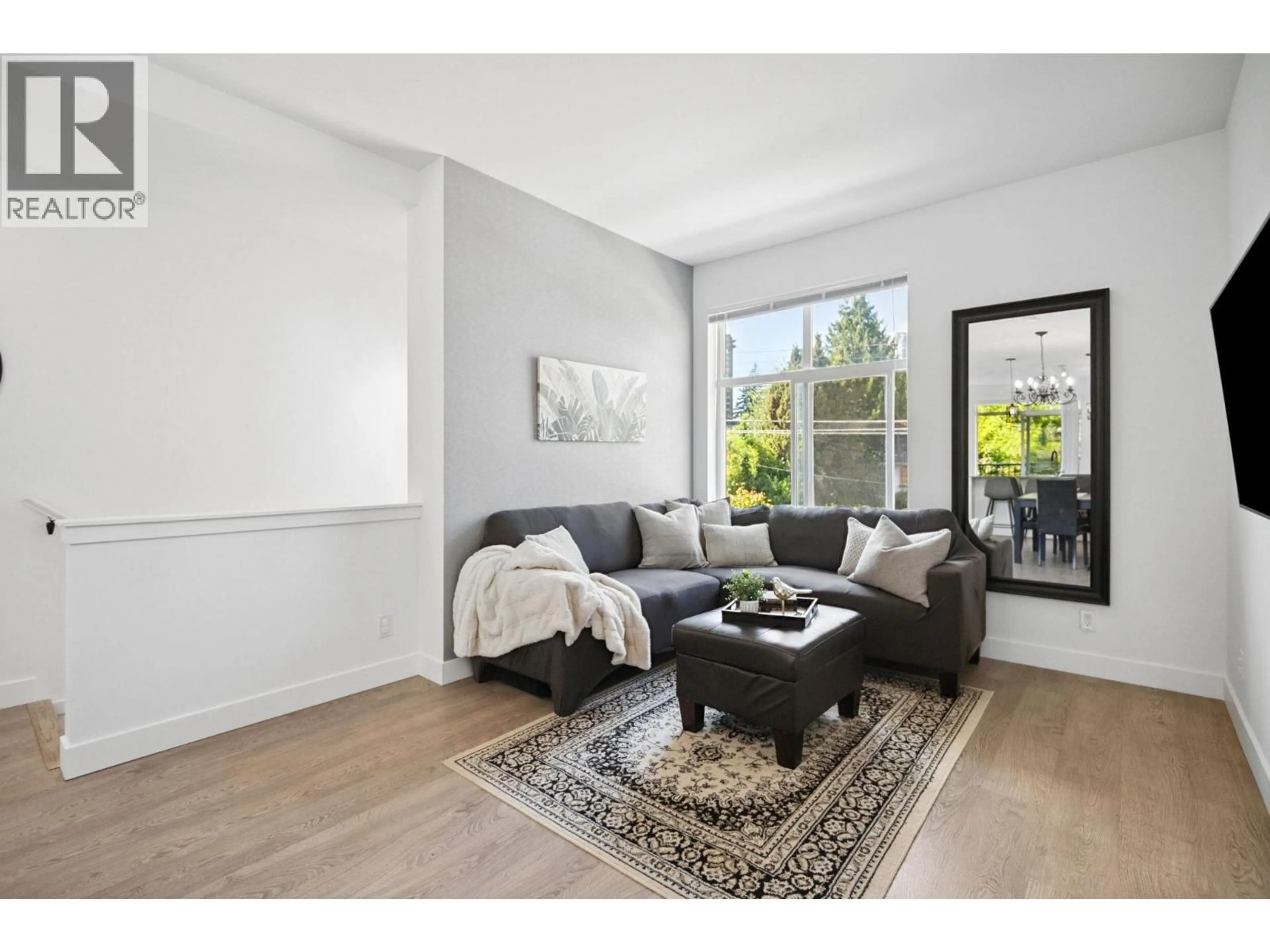 Living room with furniture, unknown for 207 - 7250 18TH AVENUE, Burnaby British Columbia V3N1H3