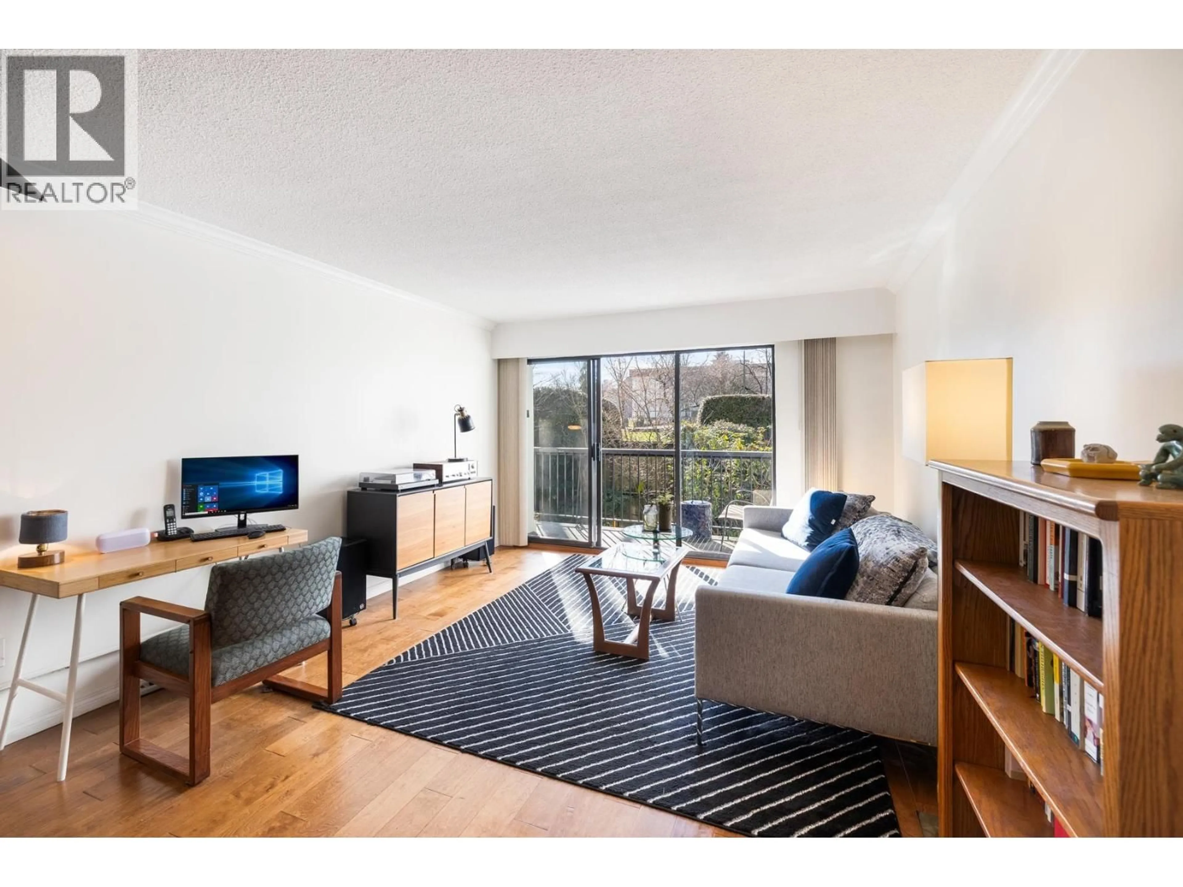 Living room with furniture, wood/laminate floor for 207 - 444 6TH AVENUE, Vancouver British Columbia V5T1K6