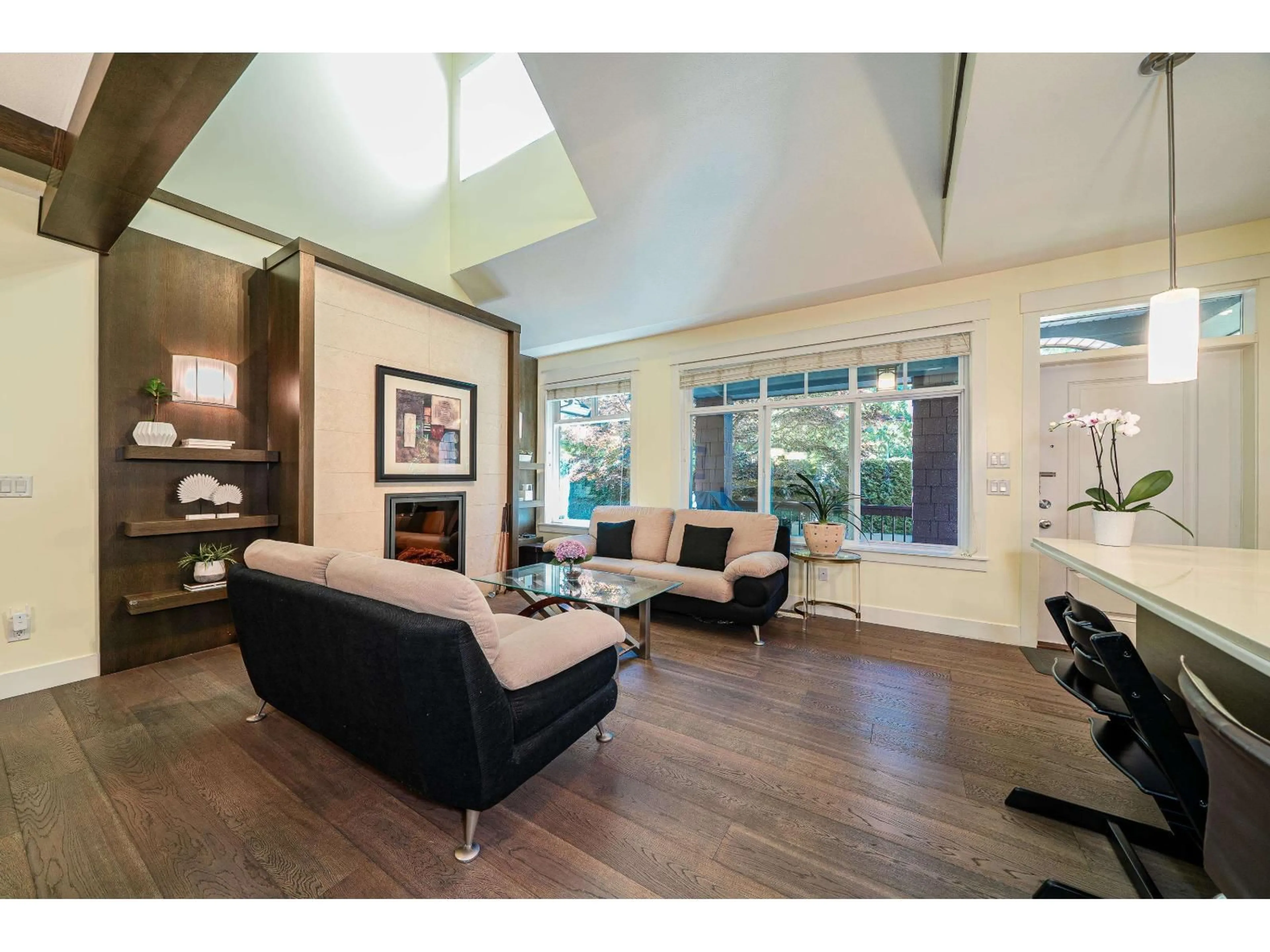 Living room with furniture, wood/laminate floor for 8 - 15977 26, Surrey British Columbia V3Z2W7