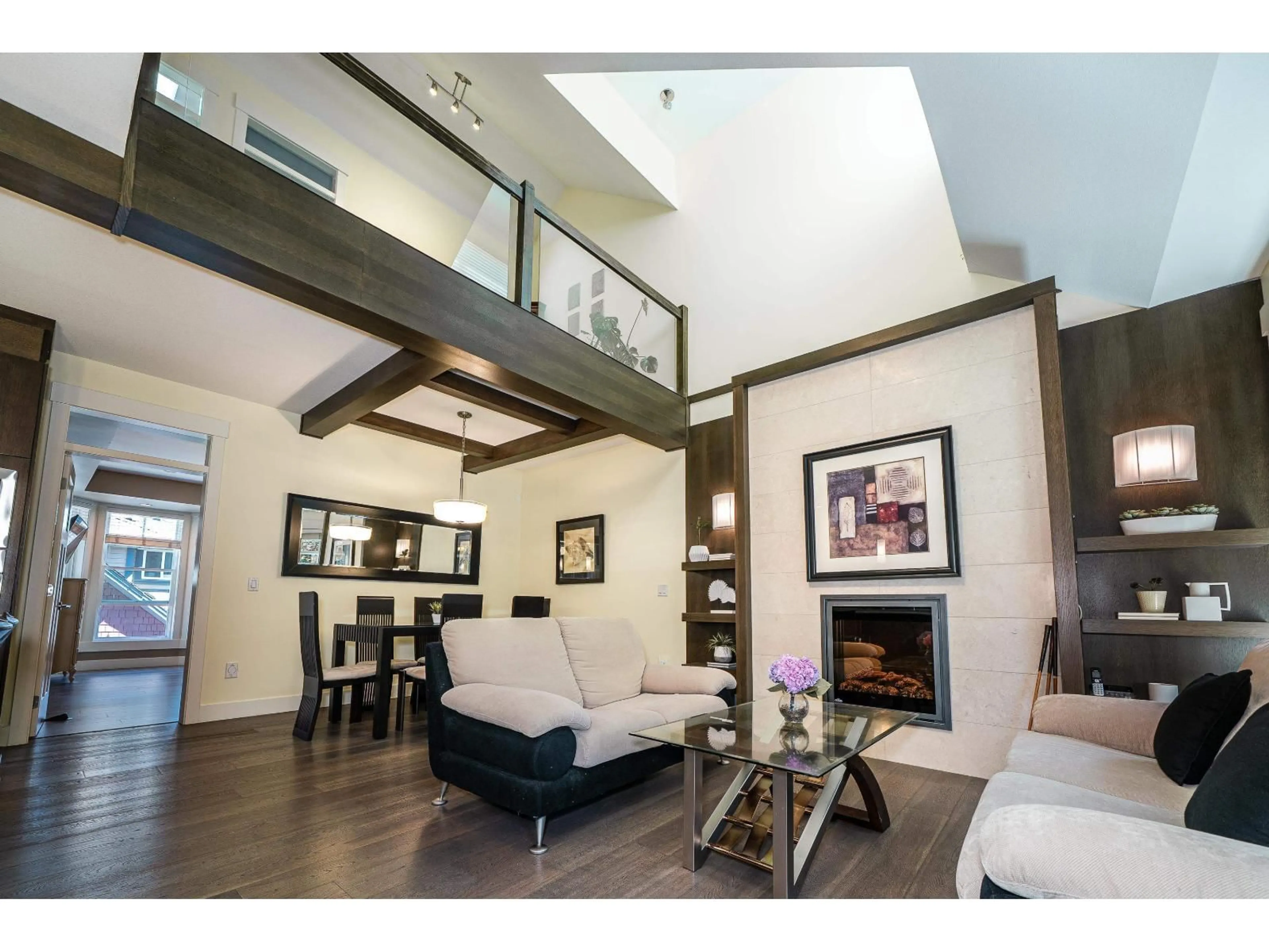 Living room with furniture, wood/laminate floor for 8 - 15977 26, Surrey British Columbia V3Z2W7