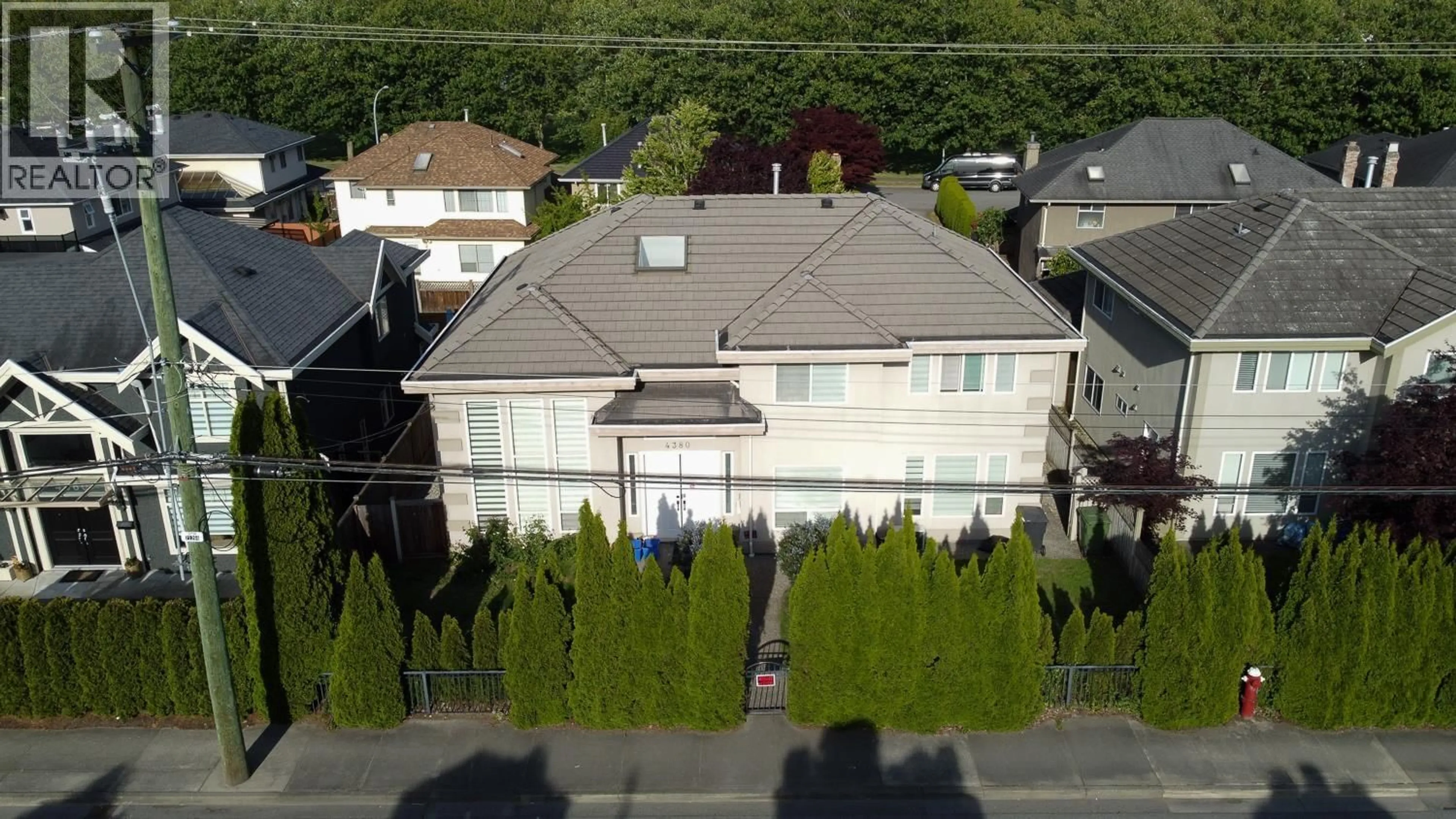 A pic from outside/outdoor area/front of a property/back of a property/a pic from drone, street for 4380 NO. 4 ROAD, Richmond British Columbia V6X2M3