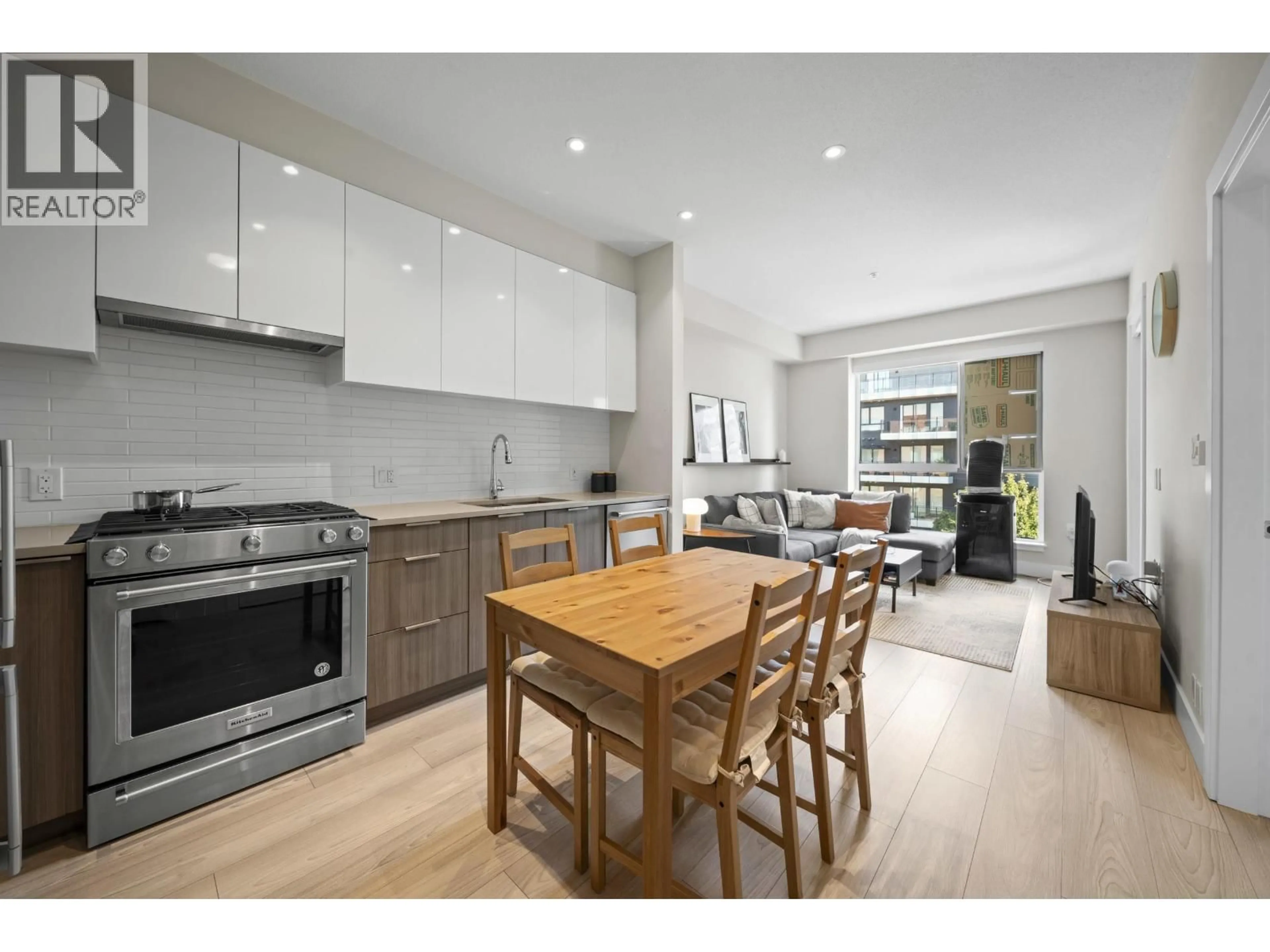 Open concept kitchen, wood/laminate floor for 401 - 8508 RIVERGRASS DRIVE, Vancouver British Columbia V5S0H7