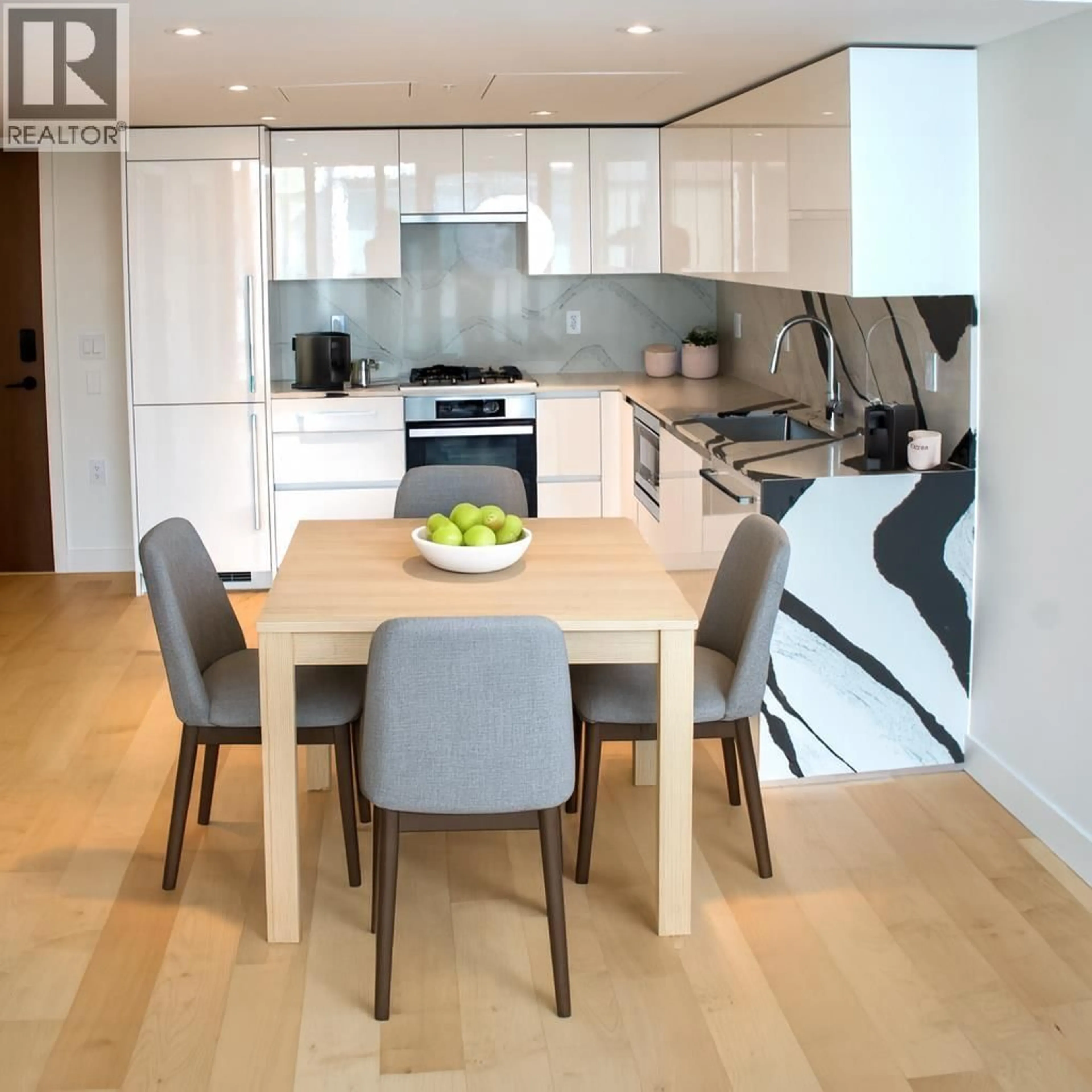 Contemporary kitchen, wood/laminate floor for 611 - 135 13 STREET, North Vancouver British Columbia V7L0J8