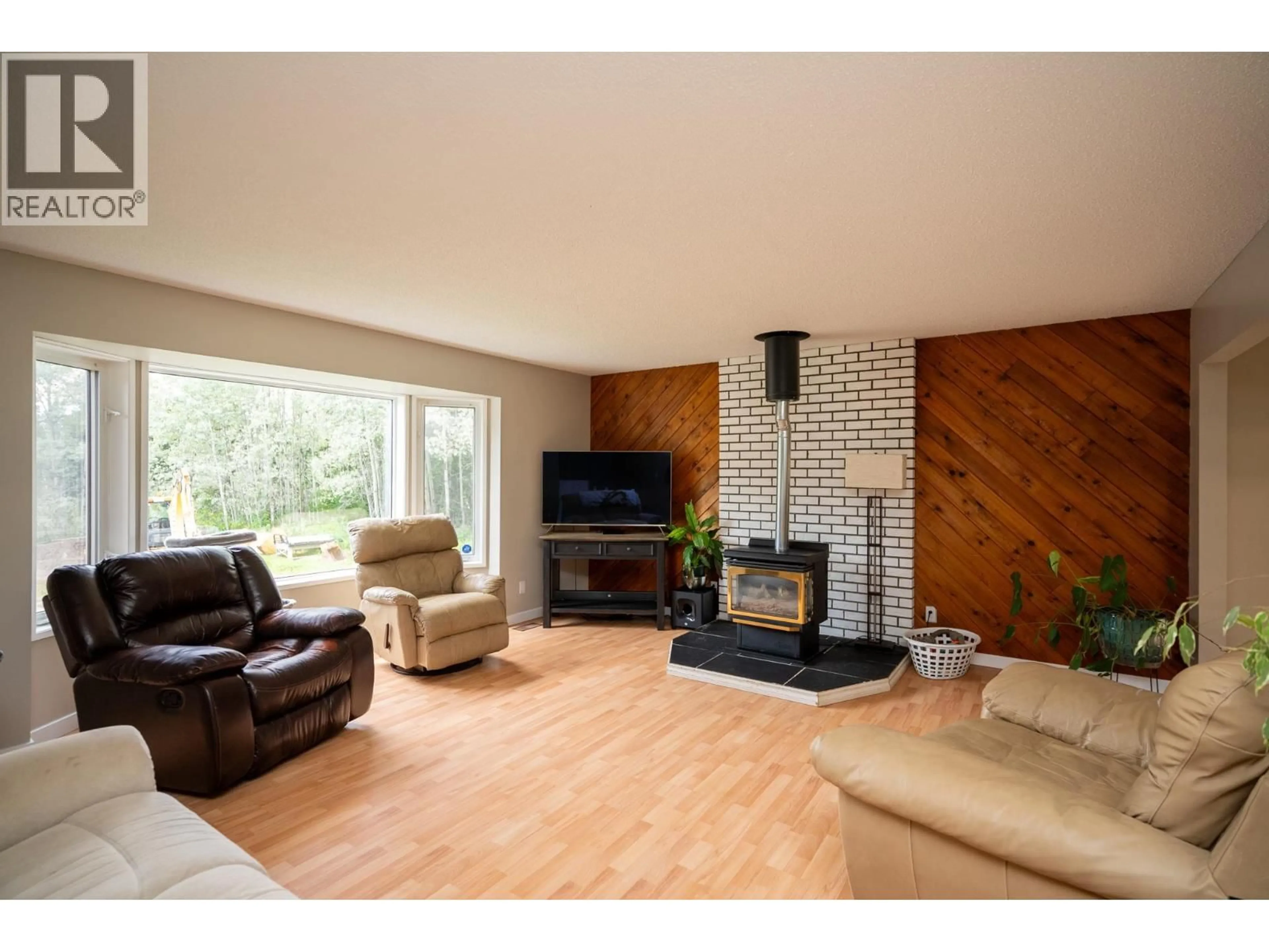 Living room with furniture, wood/laminate floor for 10985 GRASSLAND ROAD, Prince George British Columbia V2K5E8