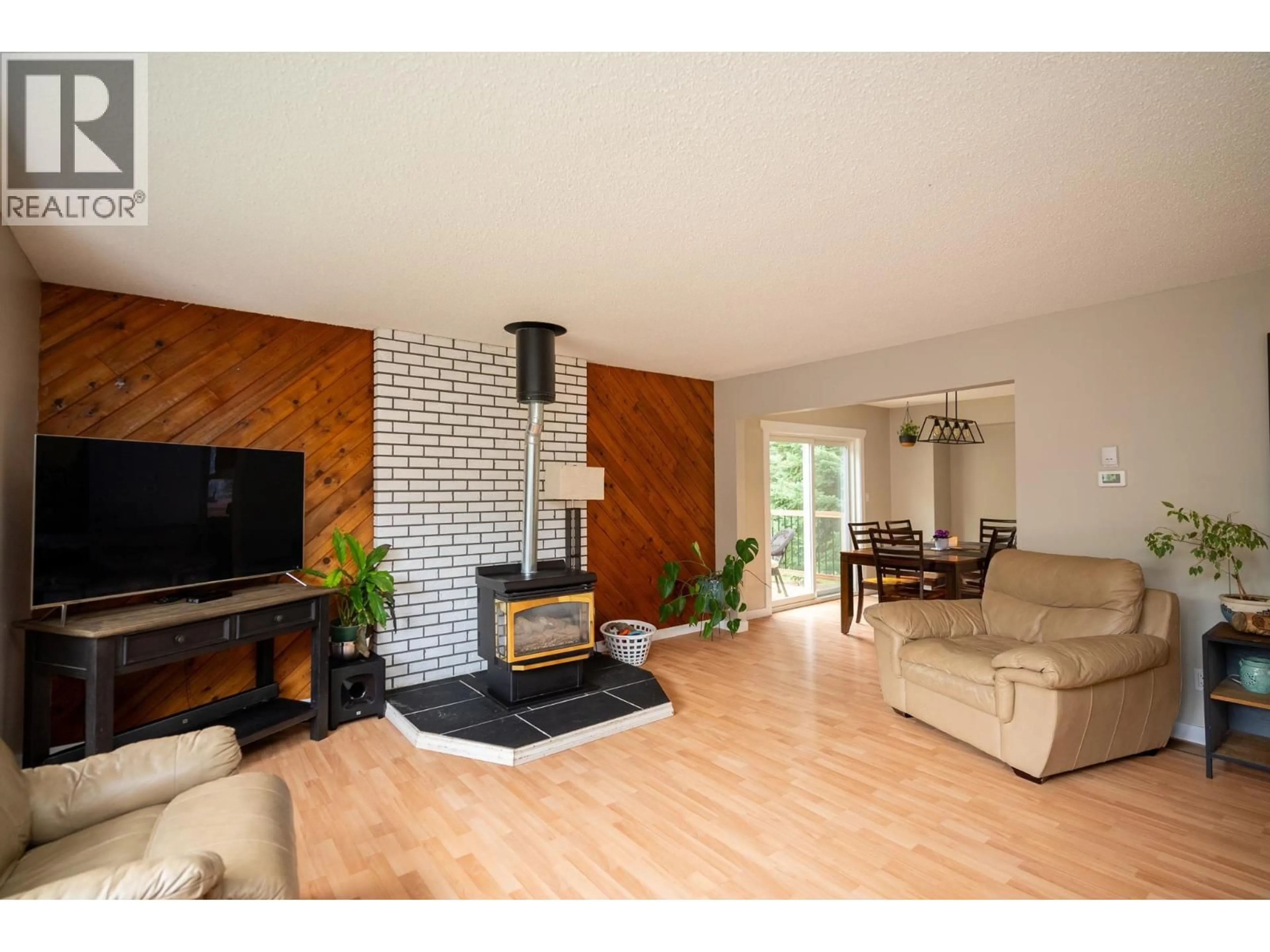 Living room with furniture, wood/laminate floor for 10985 GRASSLAND ROAD, Prince George British Columbia V2K5E8