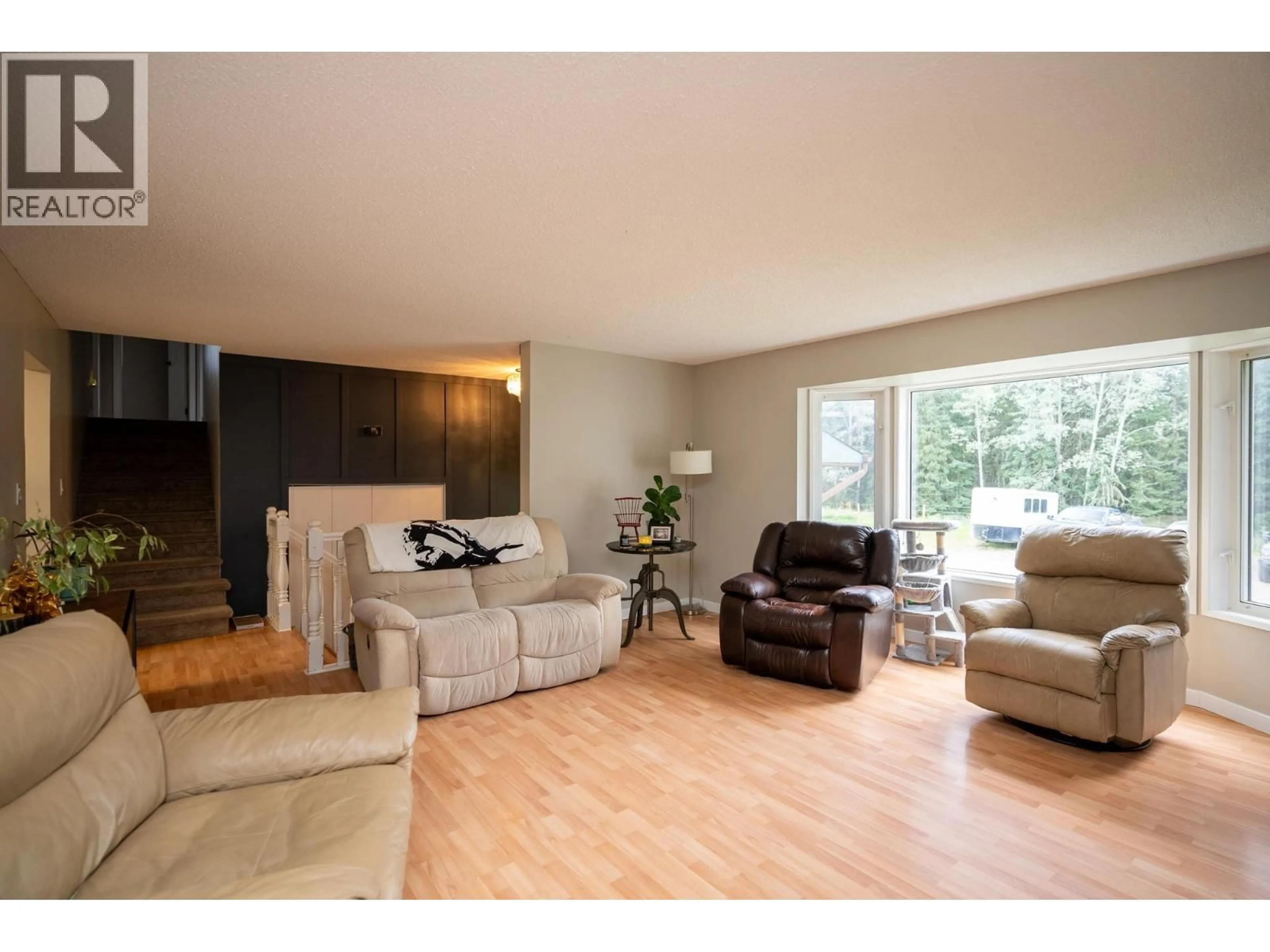 Living room with furniture, wood/laminate floor for 10985 GRASSLAND ROAD, Prince George British Columbia V2K5E8