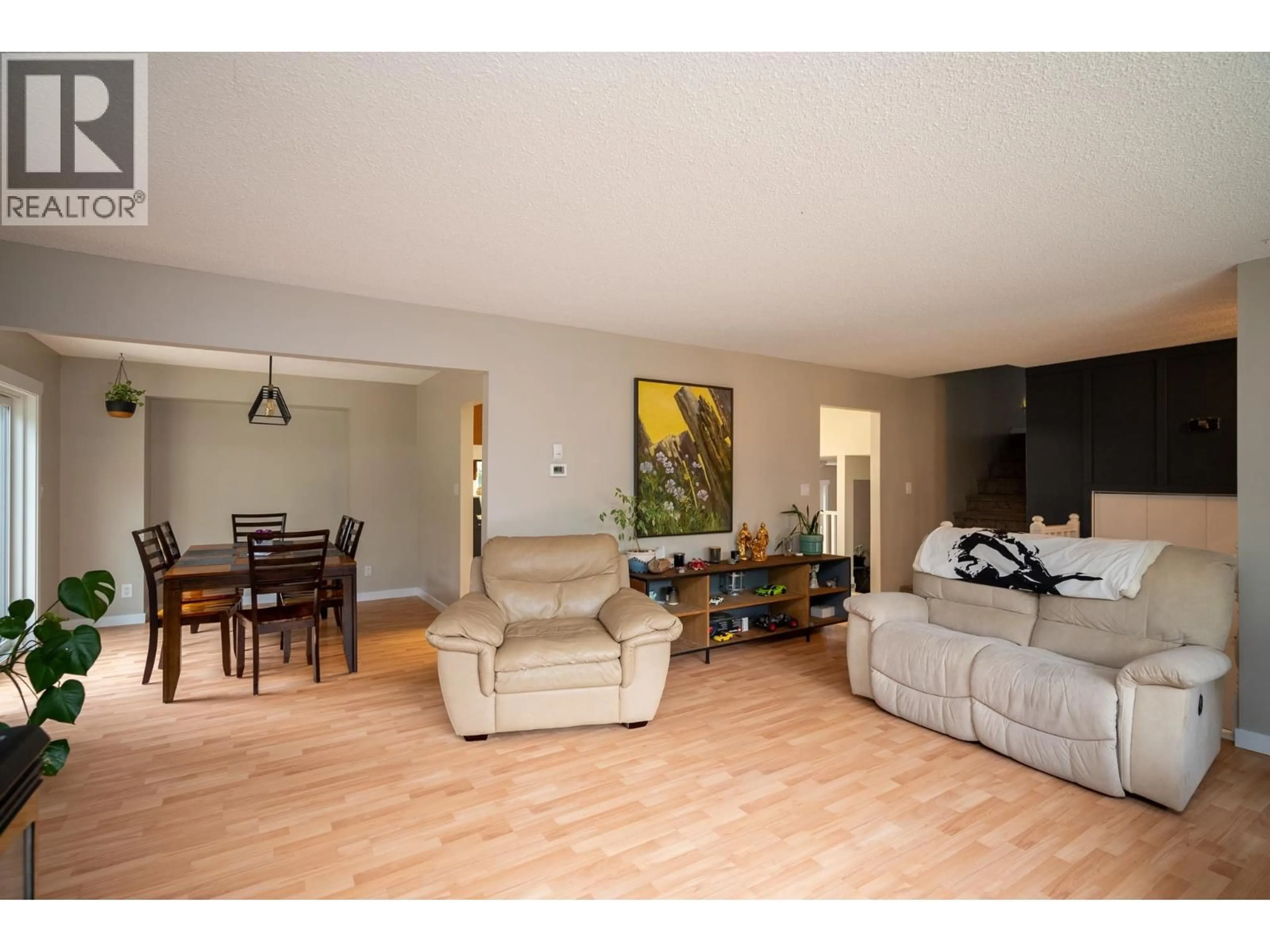 Living room with furniture, wood/laminate floor for 10985 GRASSLAND ROAD, Prince George British Columbia V2K5E8