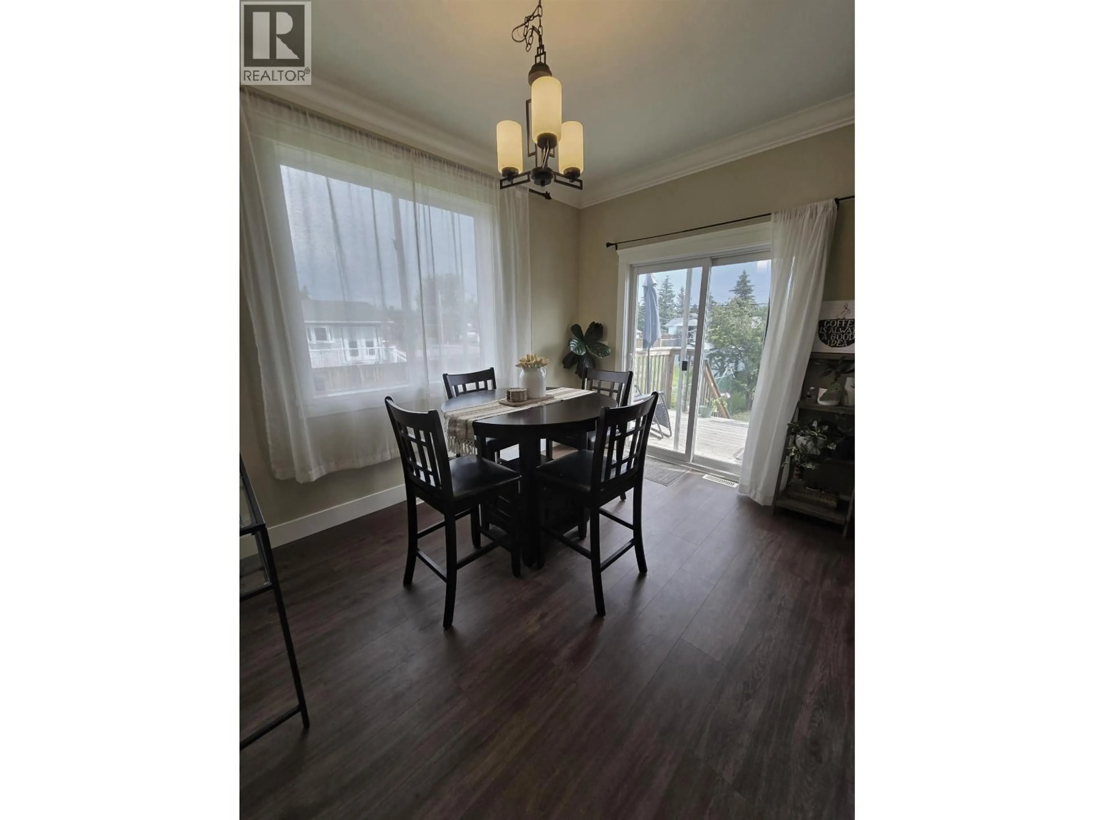 Dining room, wood/laminate floor for 8817 90 STREET, Fort St. John British Columbia V1J4K3