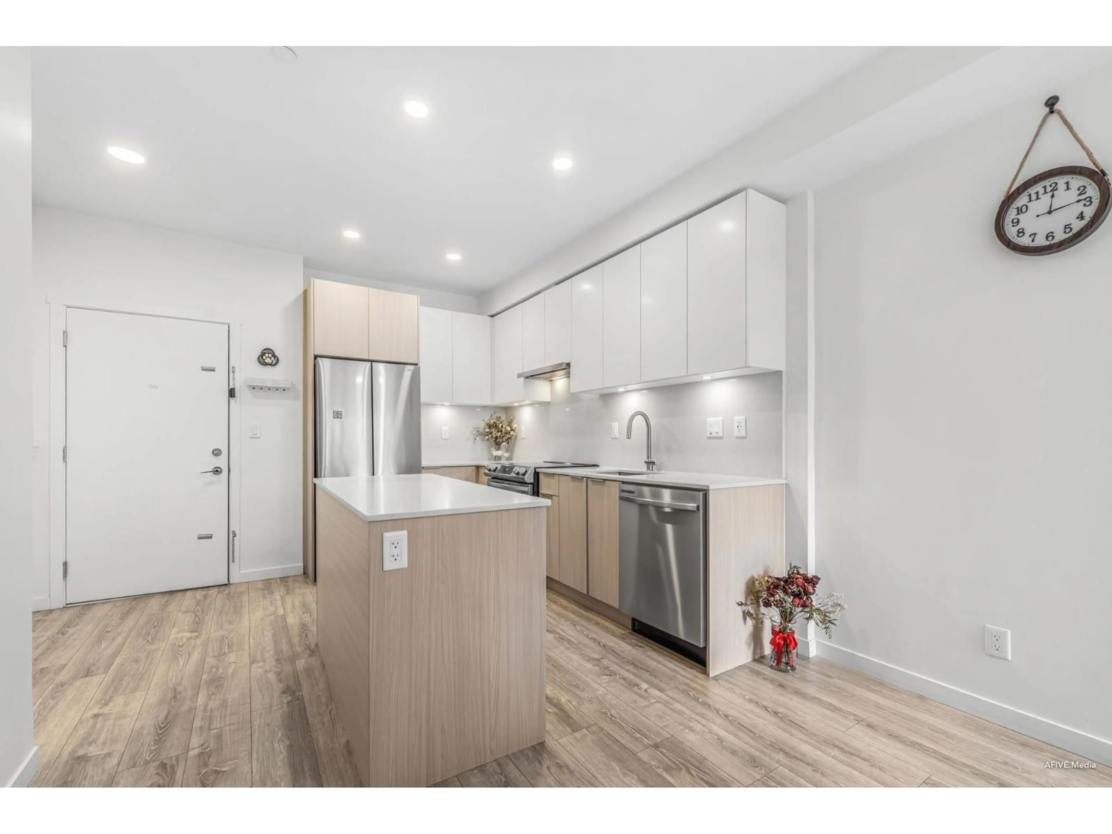 Open concept kitchen, wood/laminate floor for 430 - 13968 LAUREL, Surrey British Columbia V3T0S9