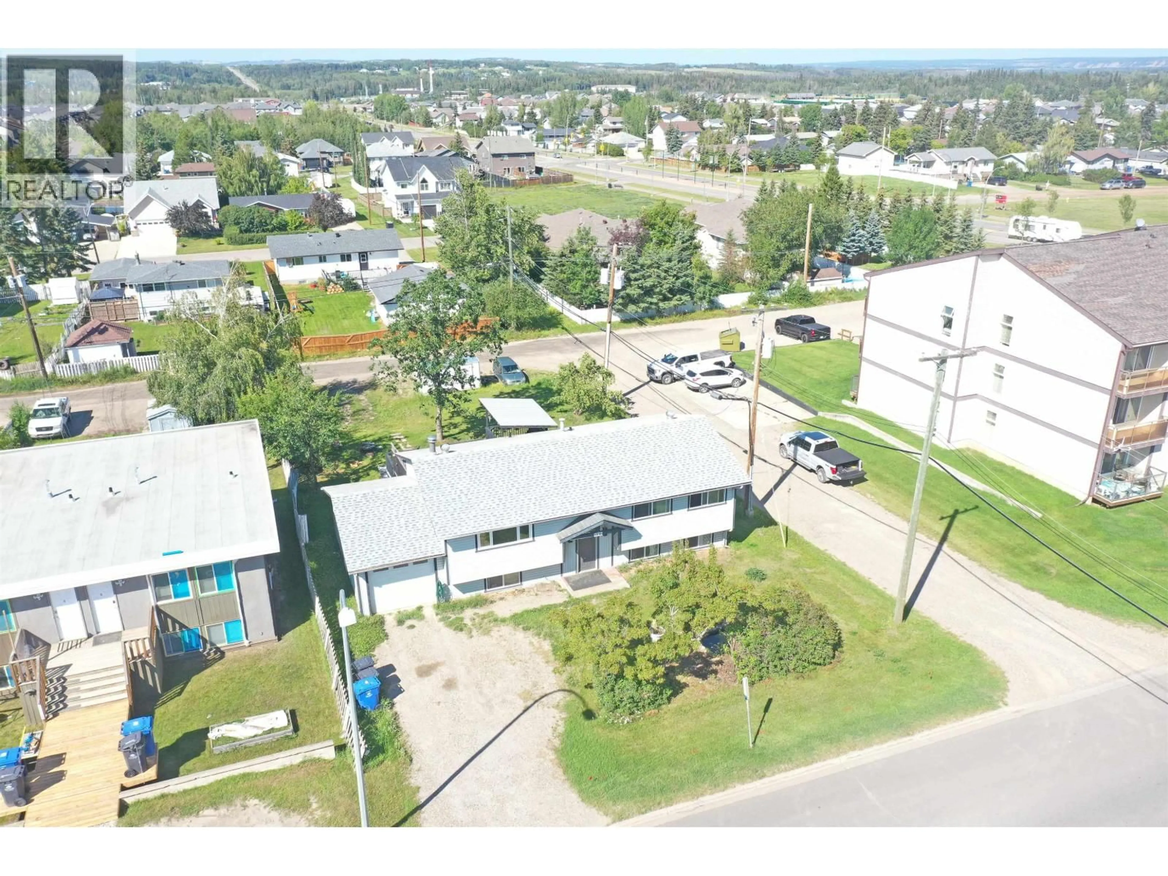A pic from outside/outdoor area/front of a property/back of a property/a pic from drone, street for 10016 110 AVENUE, Fort St. John British Columbia V1J2T2