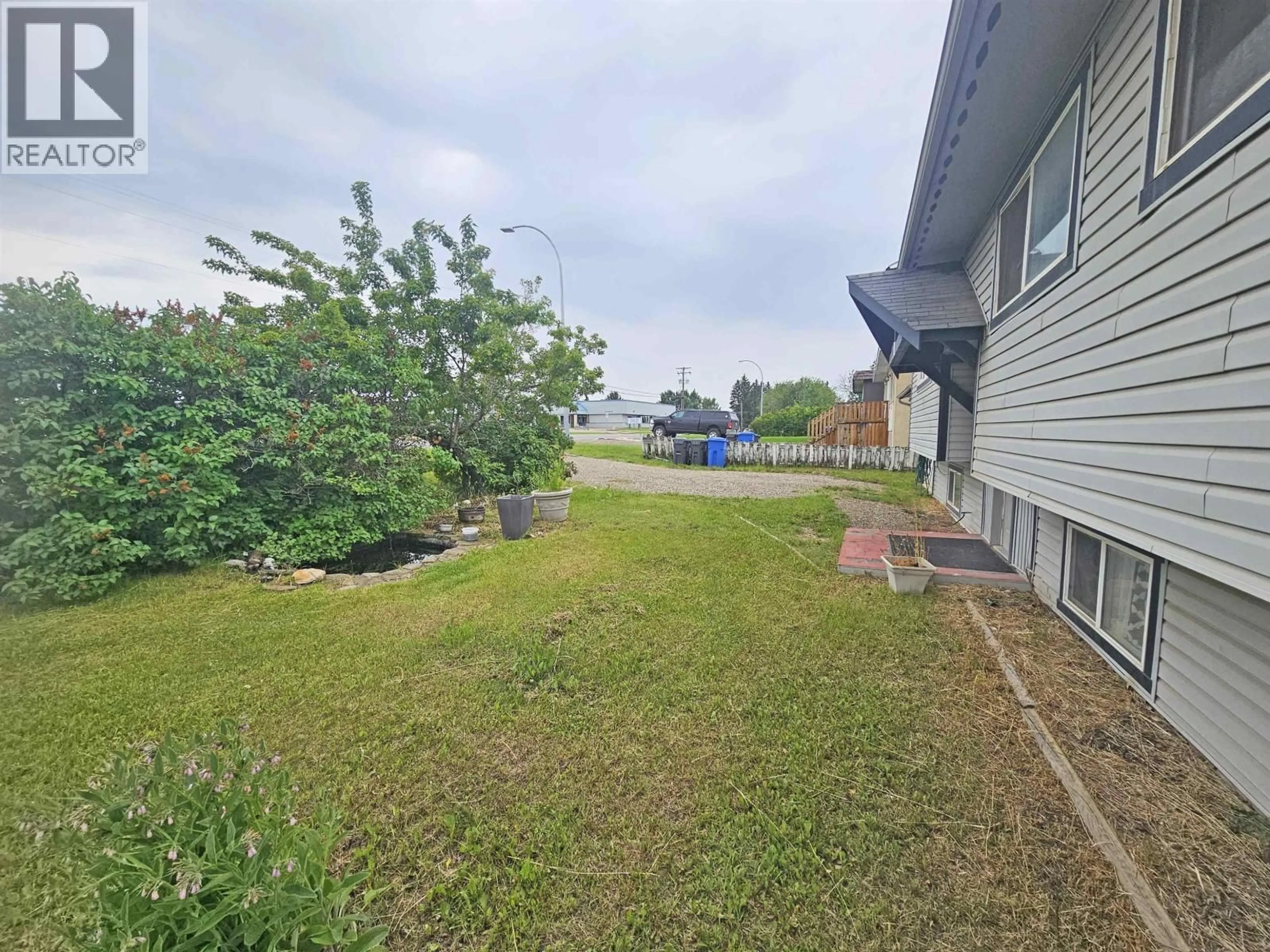 A pic from outside/outdoor area/front of a property/back of a property/a pic from drone, water/lake/river/ocean view for 10016 110 AVENUE, Fort St. John British Columbia V1J2T2
