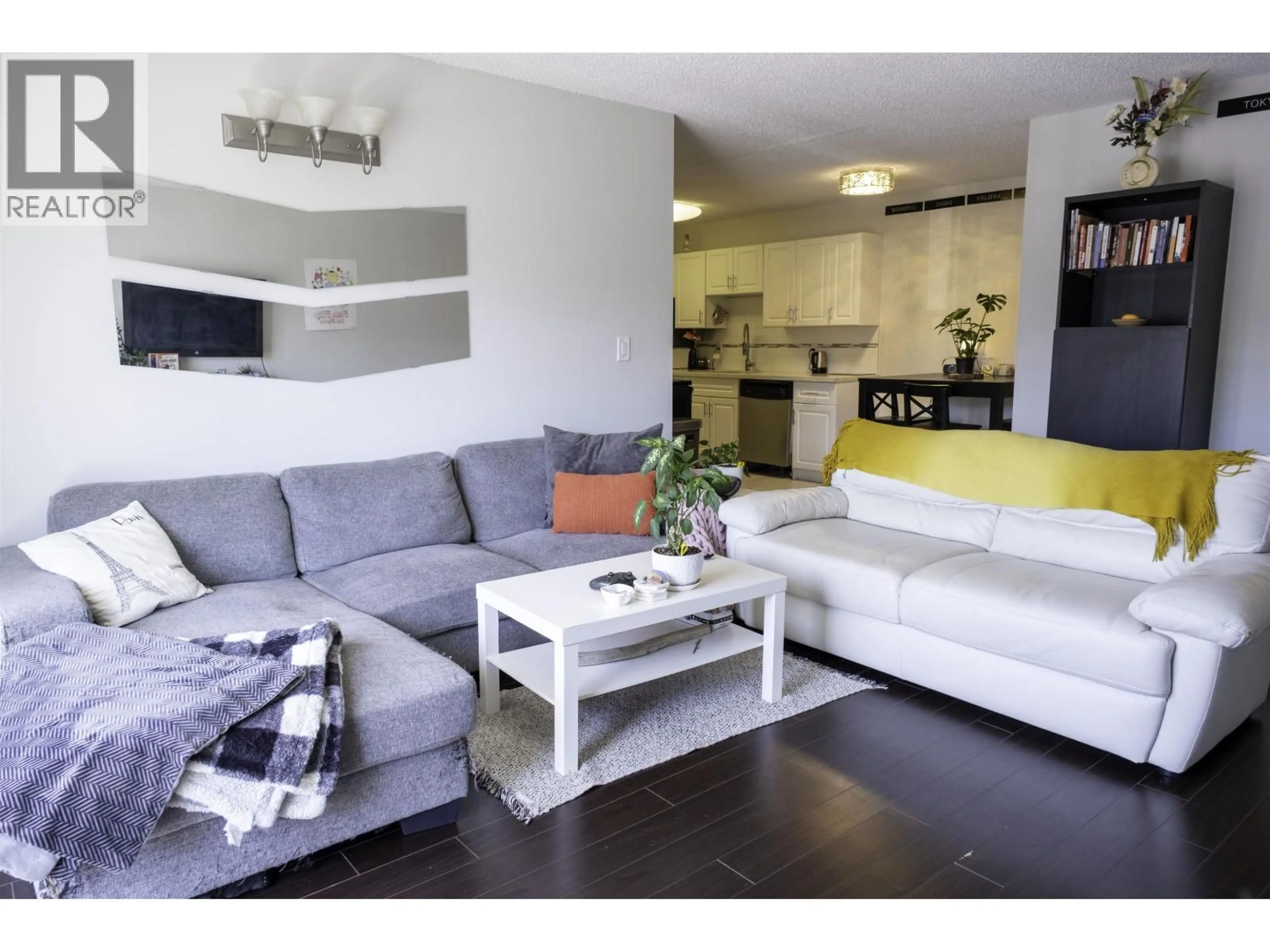 Living room with furniture, wood/laminate floor for 205 - 7180 LINDSAY ROAD, Richmond British Columbia V7C3M6