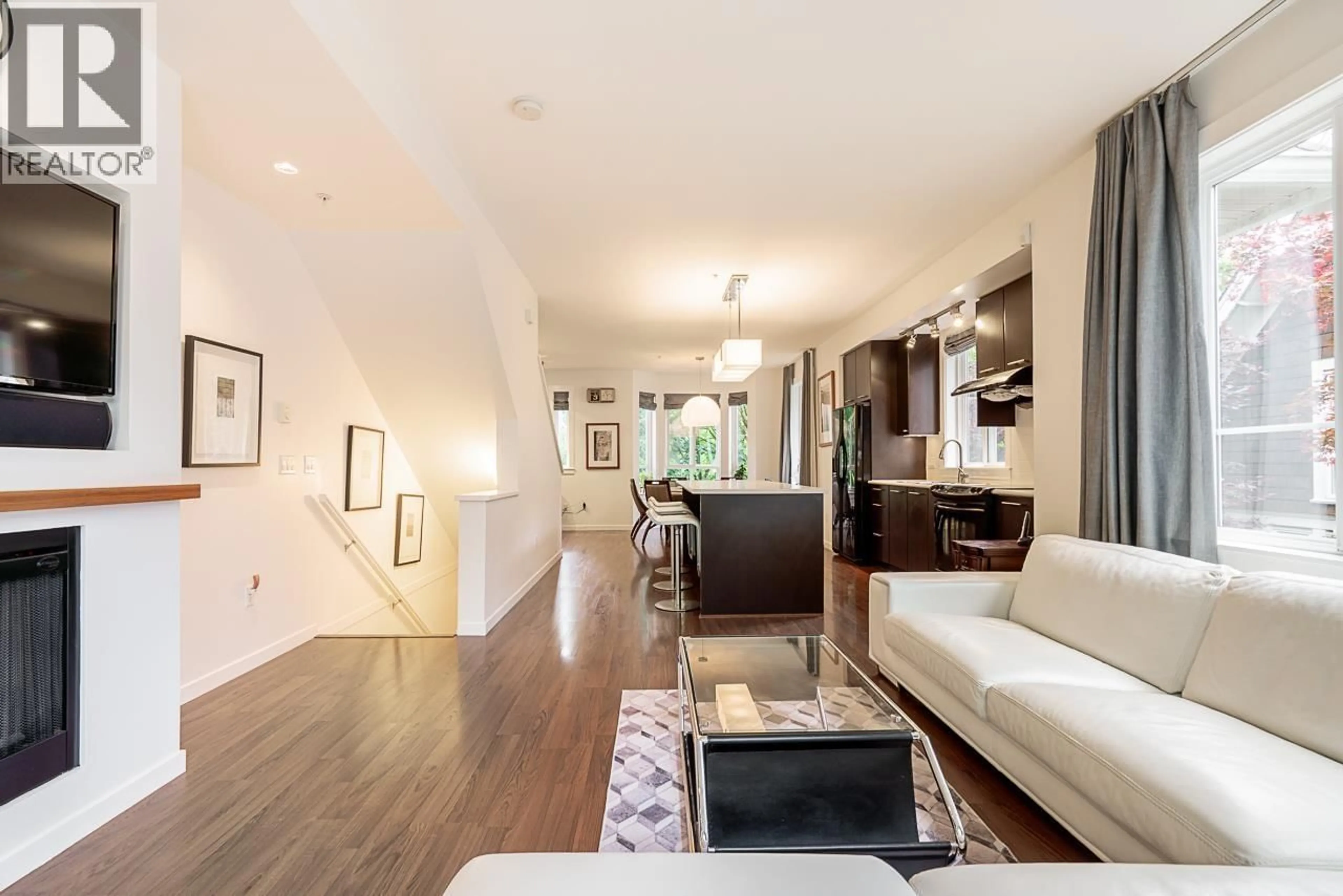 Living room with furniture, wood/laminate floor for 8 - 2418 AVON PLACE, Port Coquitlam British Columbia V3B0C7