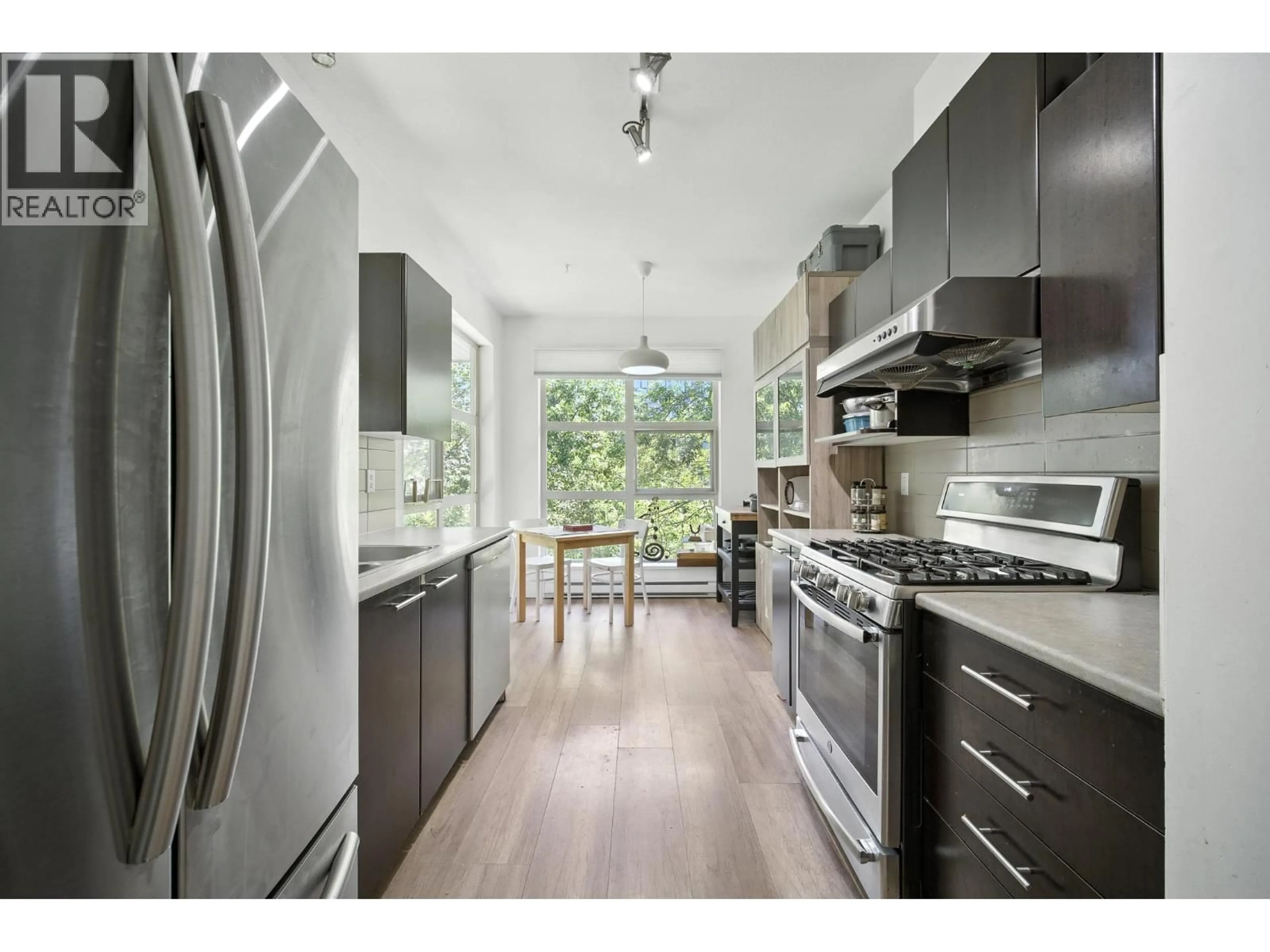 Contemporary kitchen, wood/laminate floor for 407 - 9319 UNIVERSITY CRESCENT, Burnaby British Columbia V5A4Y5