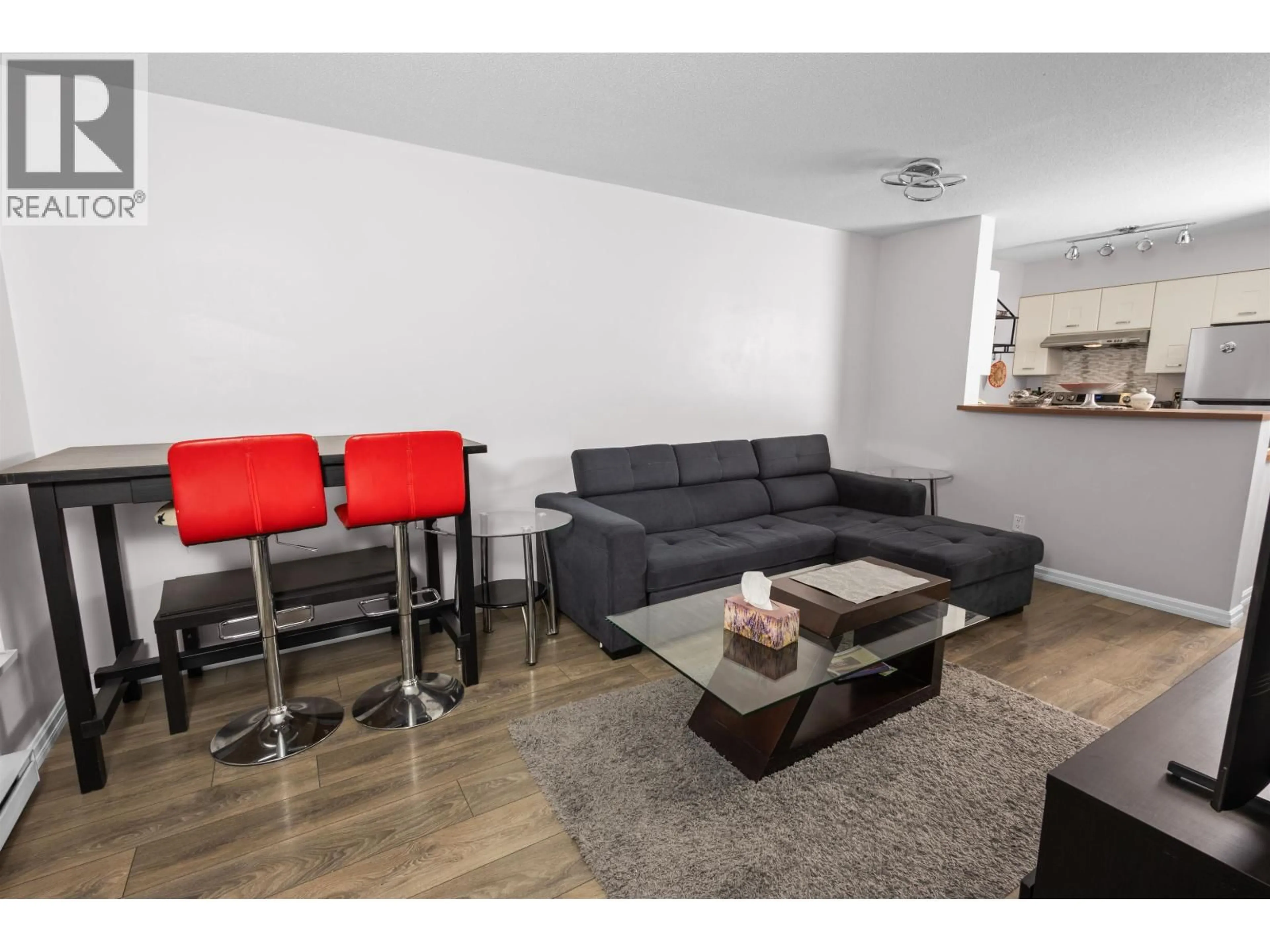 Living room with furniture, wood/laminate floor for 502 - 3438 VANNESS AVENUE, Vancouver British Columbia V5R6E7