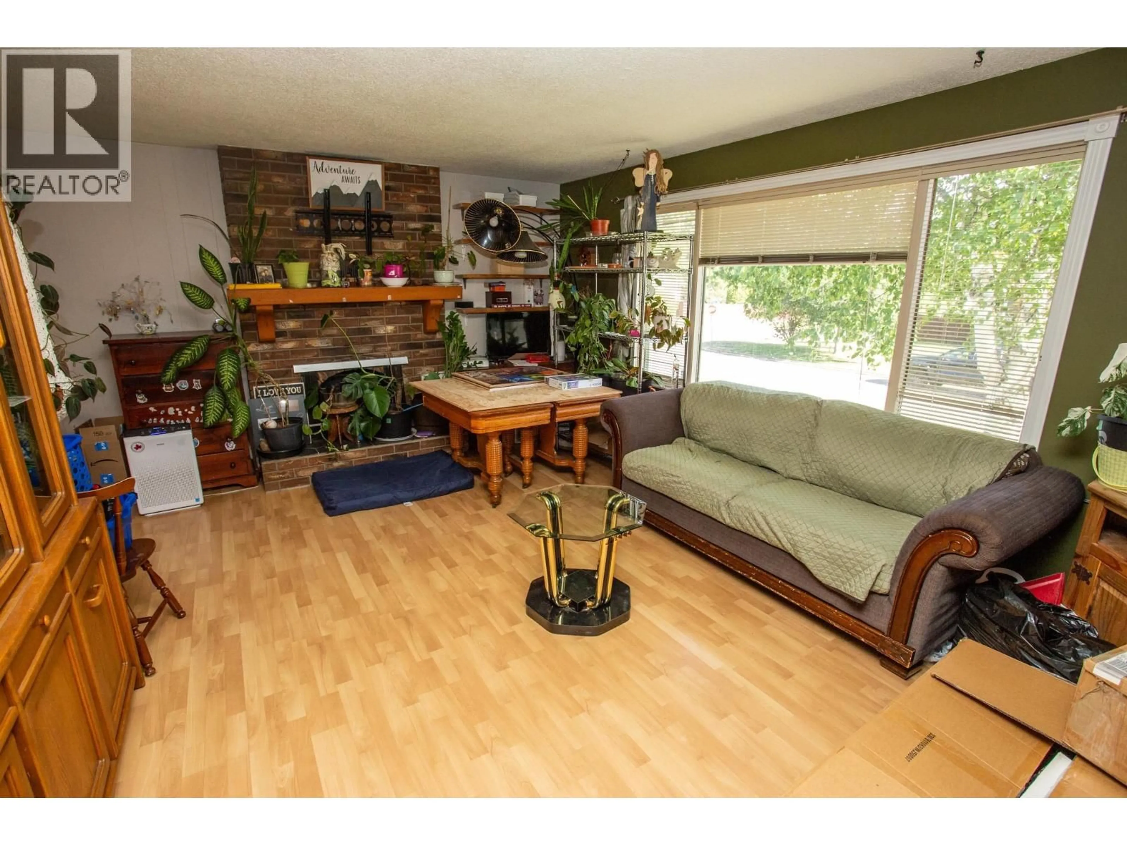 Living room with furniture, wood/laminate floor for 7386 IMPERIAL PLACE, Prince George British Columbia V2N2T9