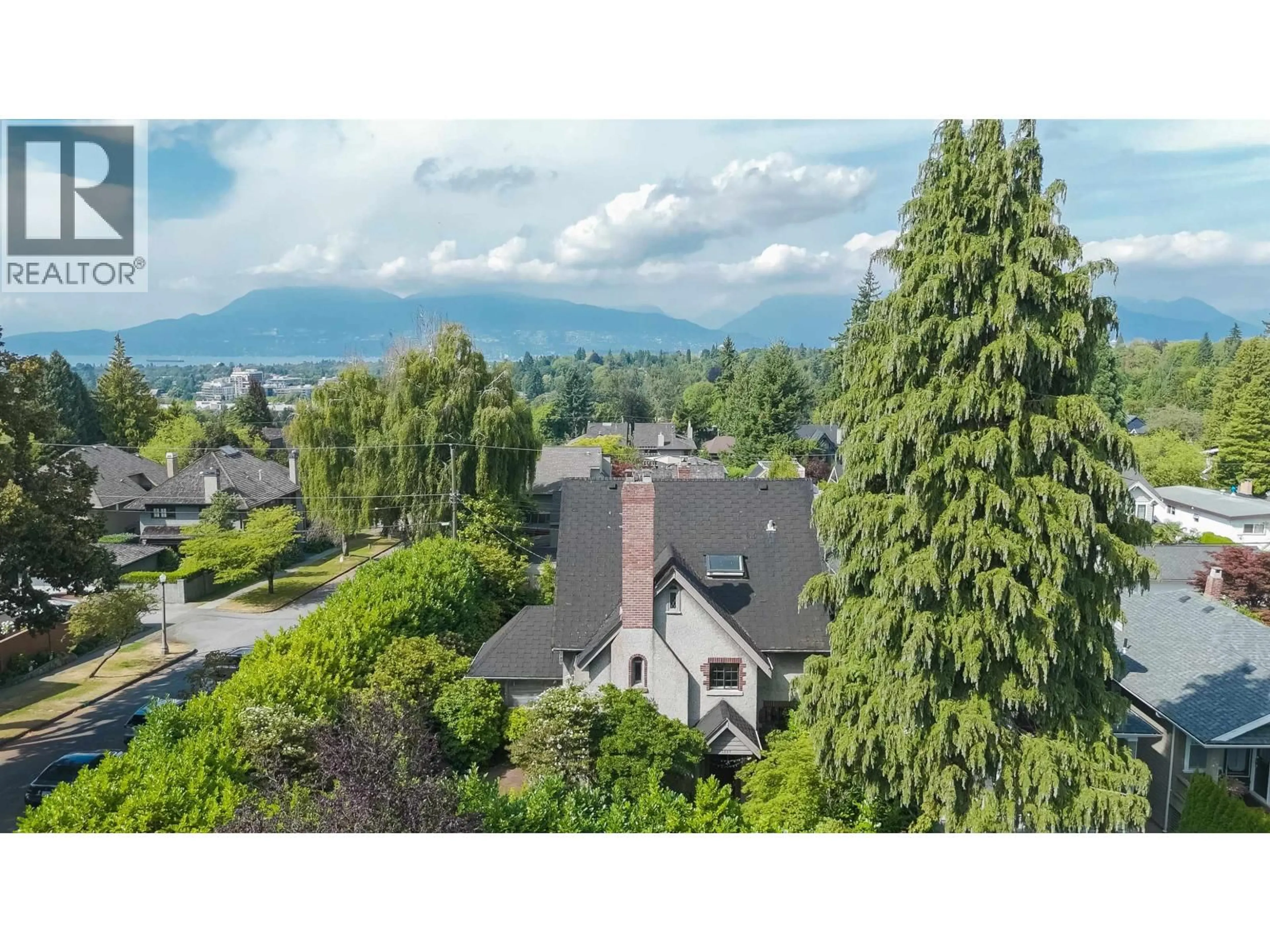 A pic from outside/outdoor area/front of a property/back of a property/a pic from drone, mountain view for 1897 37TH AVENUE, Vancouver British Columbia V6M1N3