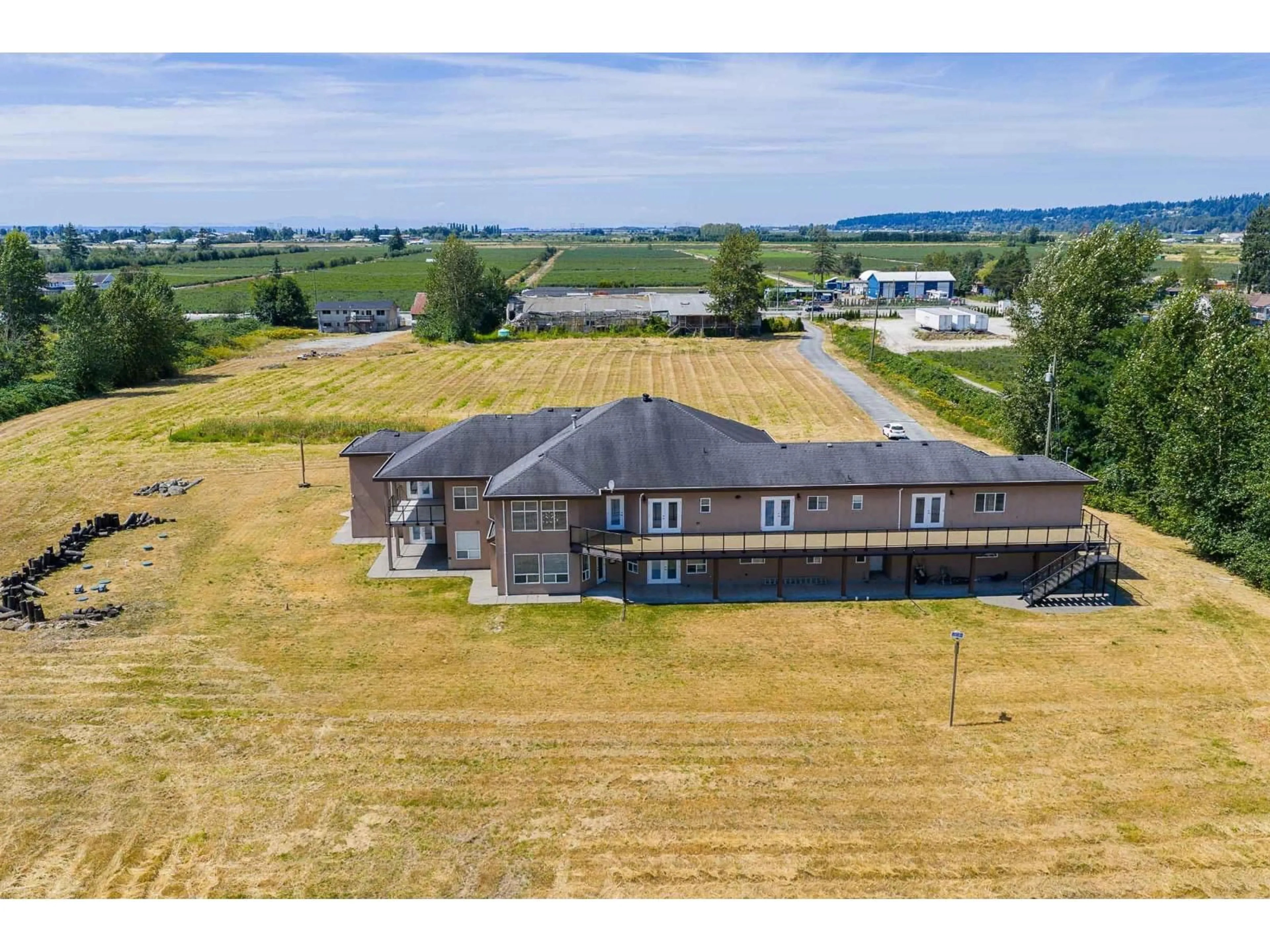 A pic from outside/outdoor area/front of a property/back of a property/a pic from drone, building for 4490 152, Surrey British Columbia V3Z1G8