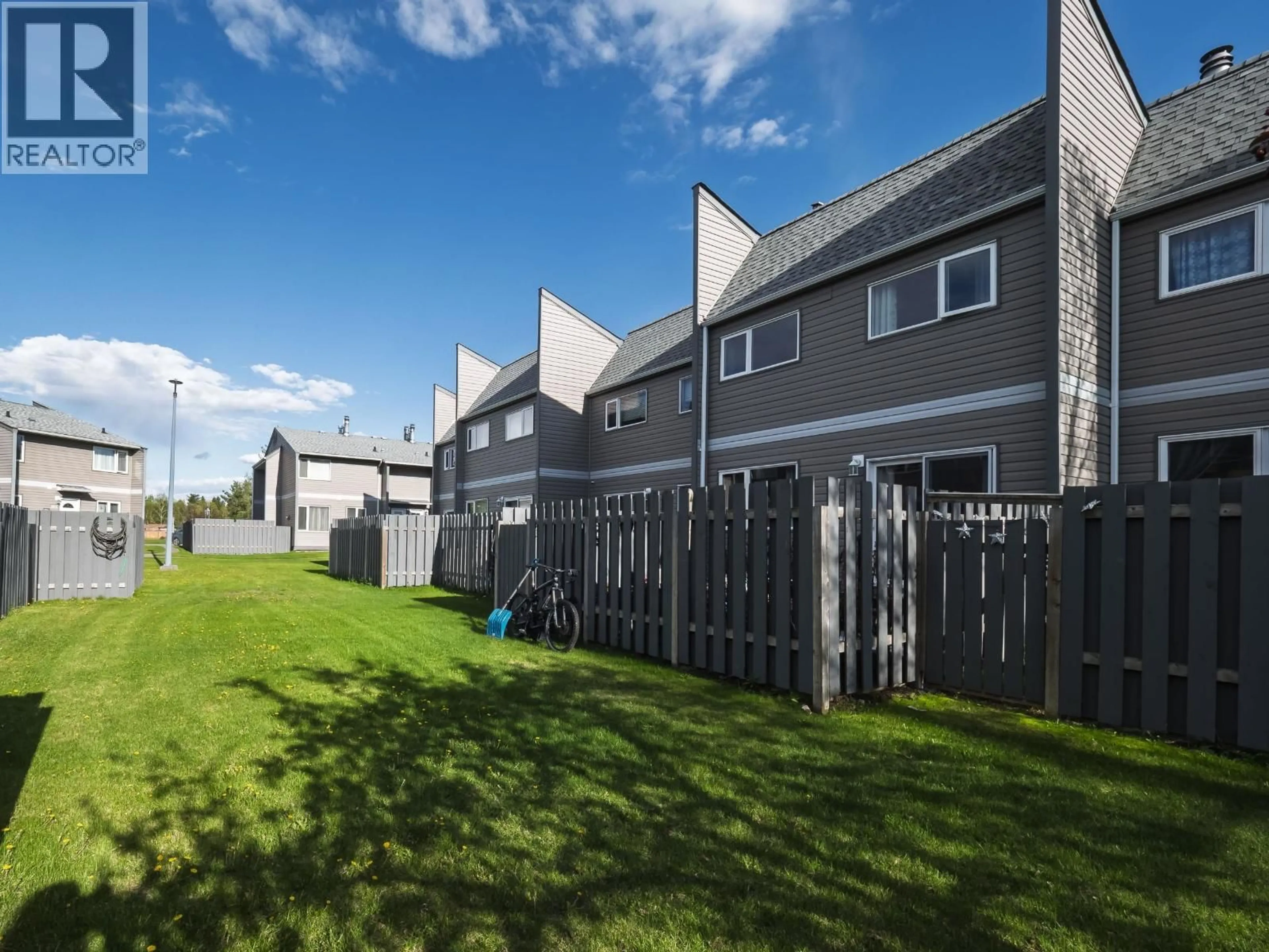 A pic from outside/outdoor area/front of a property/back of a property/a pic from drone, street for 317 - 2550 OSPIKA BOULEVARD, Prince George British Columbia V2N3T2