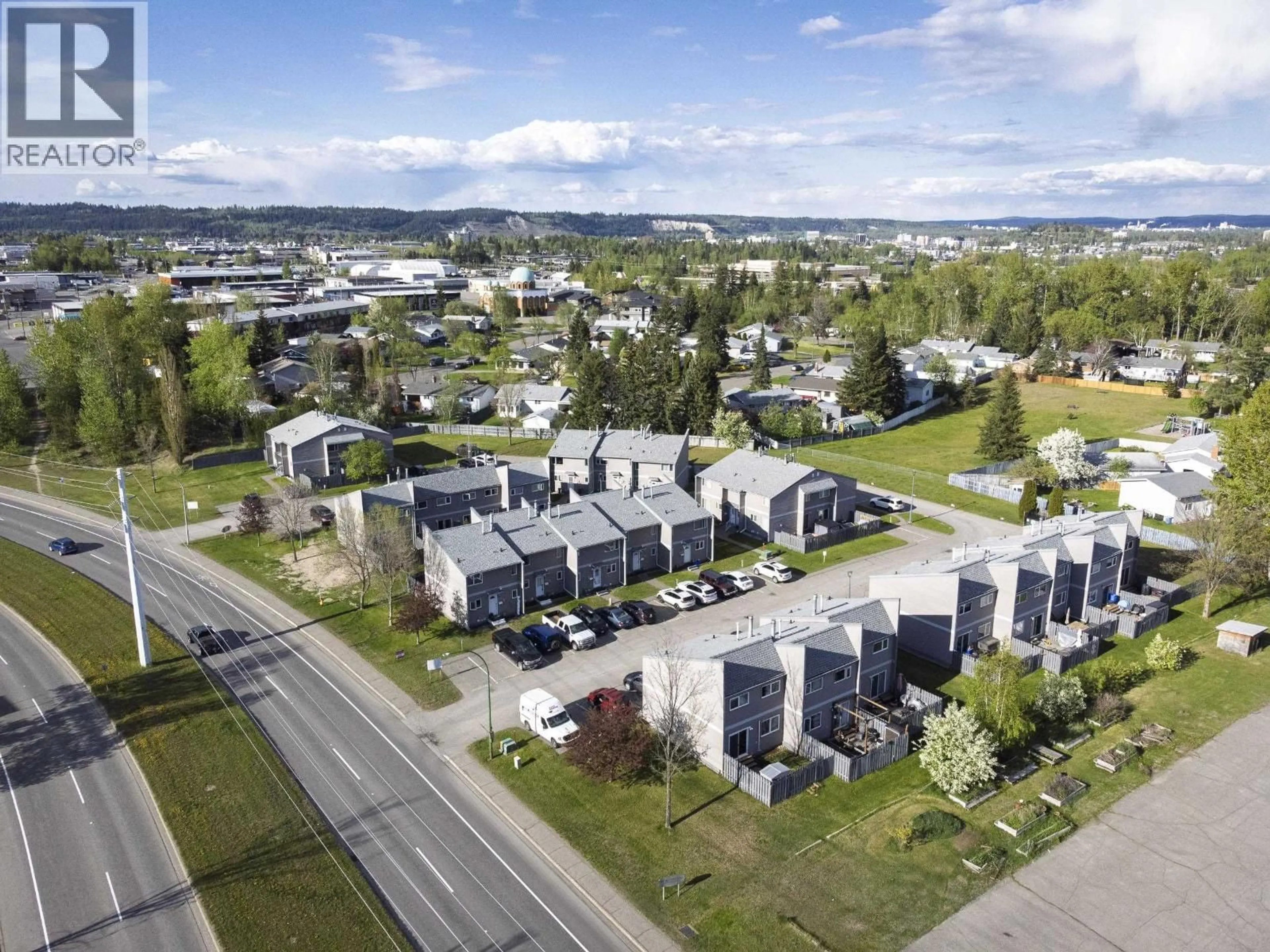 A pic from outside/outdoor area/front of a property/back of a property/a pic from drone, street for 317 - 2550 OSPIKA BOULEVARD, Prince George British Columbia V2N3T2
