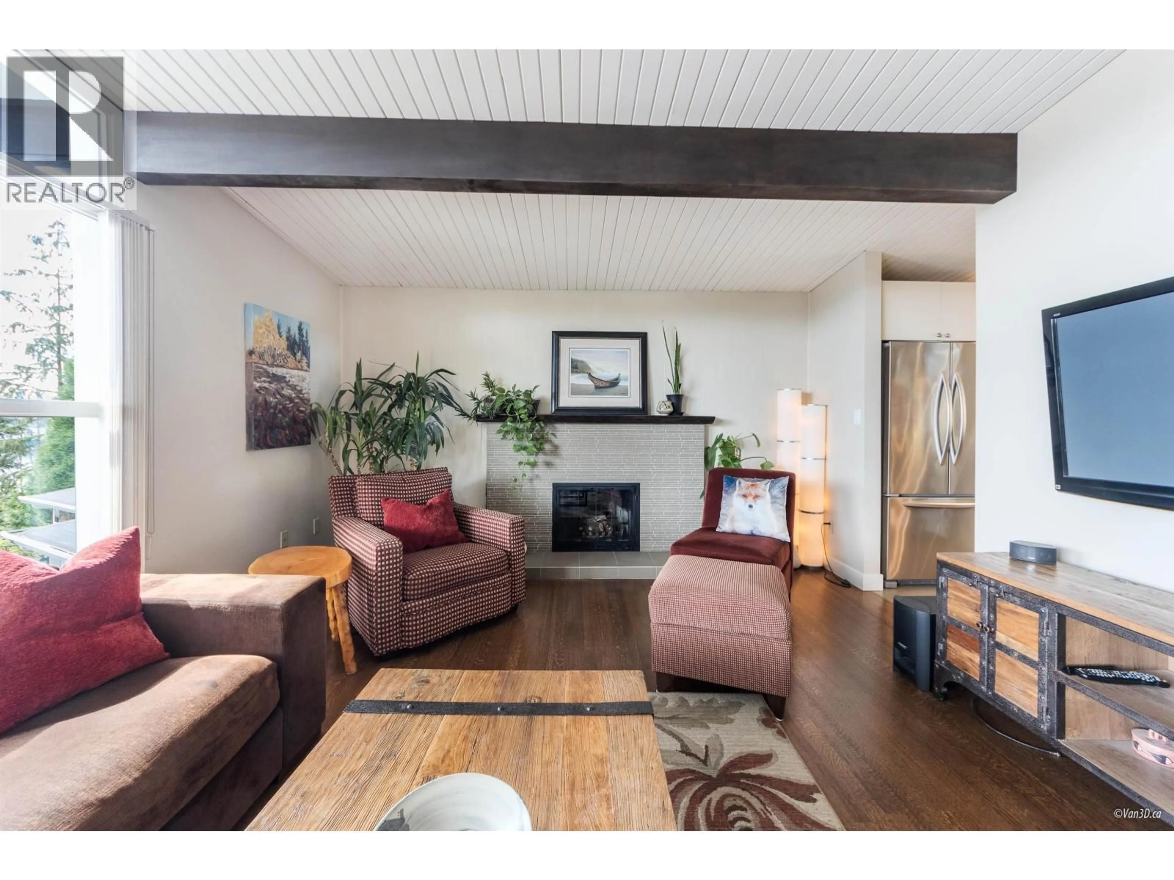 Living room with furniture, wood/laminate floor for 663 FORESTHILL PLACE, Port Moody British Columbia V3H3A2