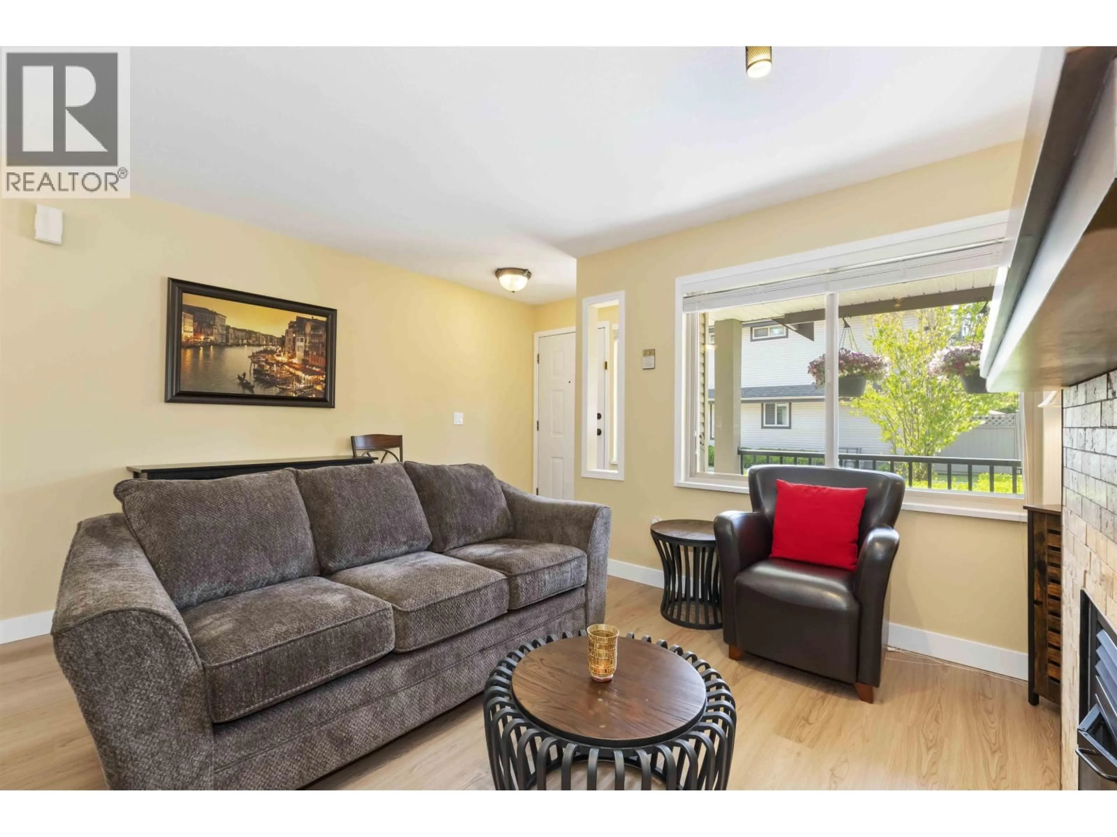 Living room with furniture, wood/laminate floor for 11 - 11860 210 STREET, Maple Ridge British Columbia V2X8A3