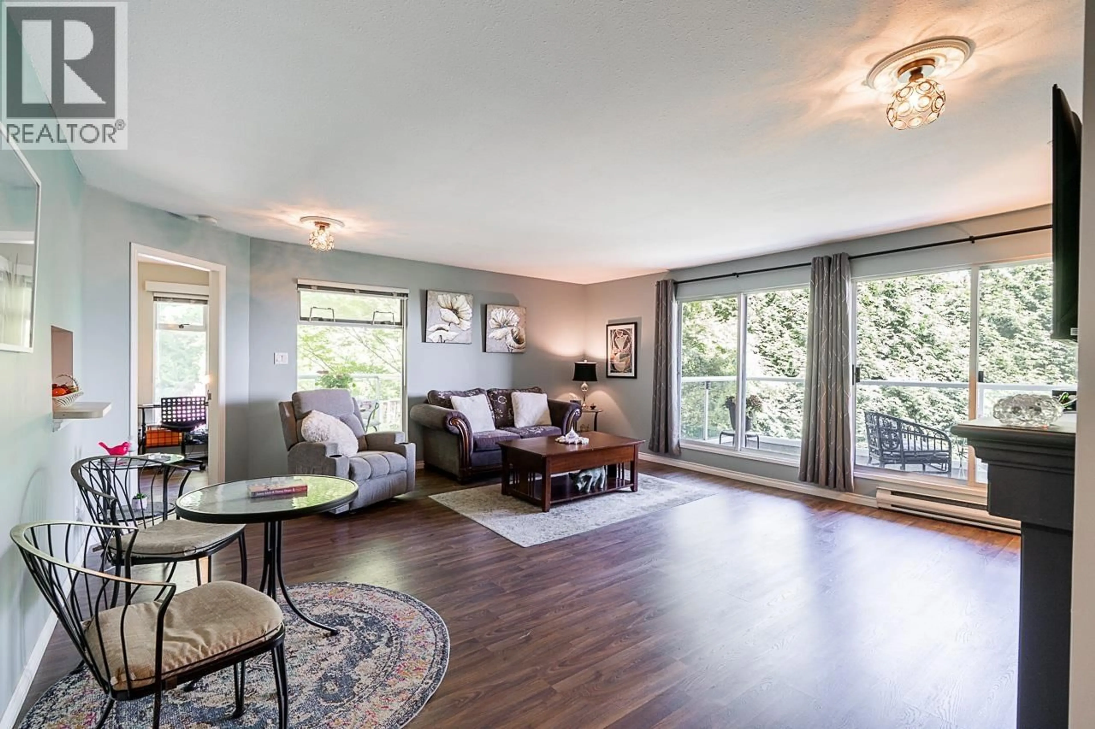 Living room with furniture, wood/laminate floor for 308 - 2733 ATLIN PLACE, Coquitlam British Columbia V3C5B1