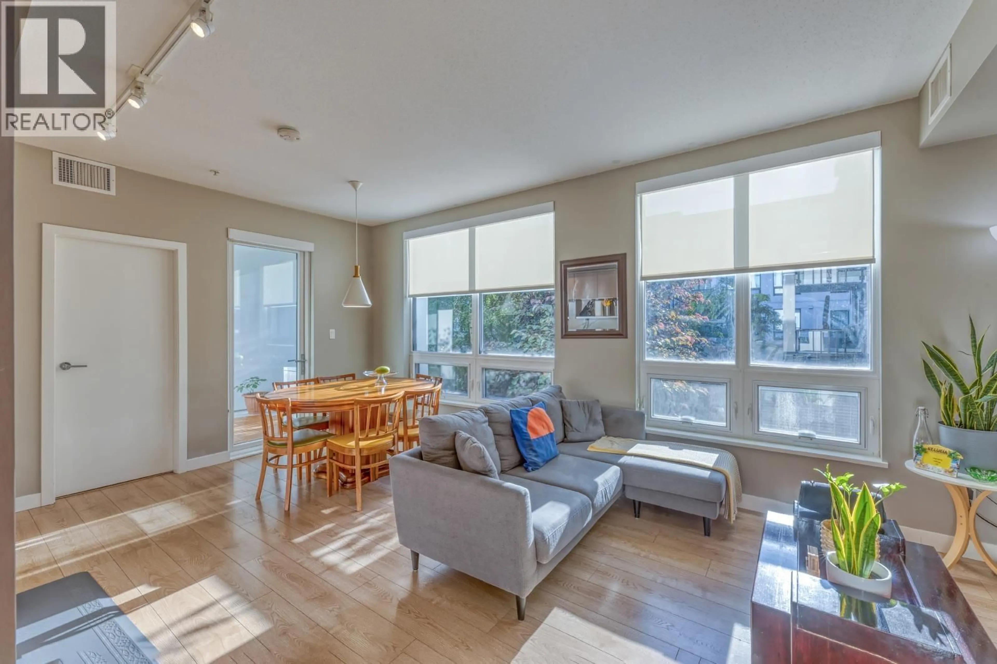 Living room with furniture, wood/laminate floor for 213 - 9388 ODLIN ROAD, Richmond British Columbia V6X0L5