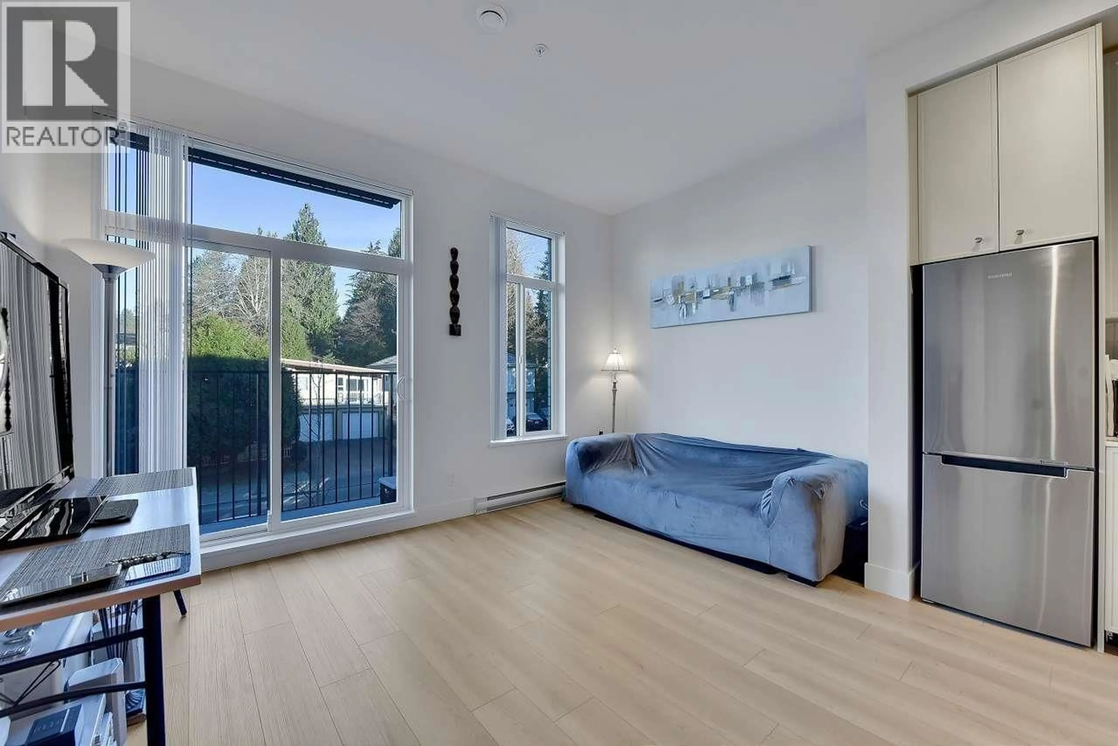Living room with furniture, wood/laminate floor for 211 - 708 EDGAR AVENUE, Coquitlam British Columbia V3K0H3