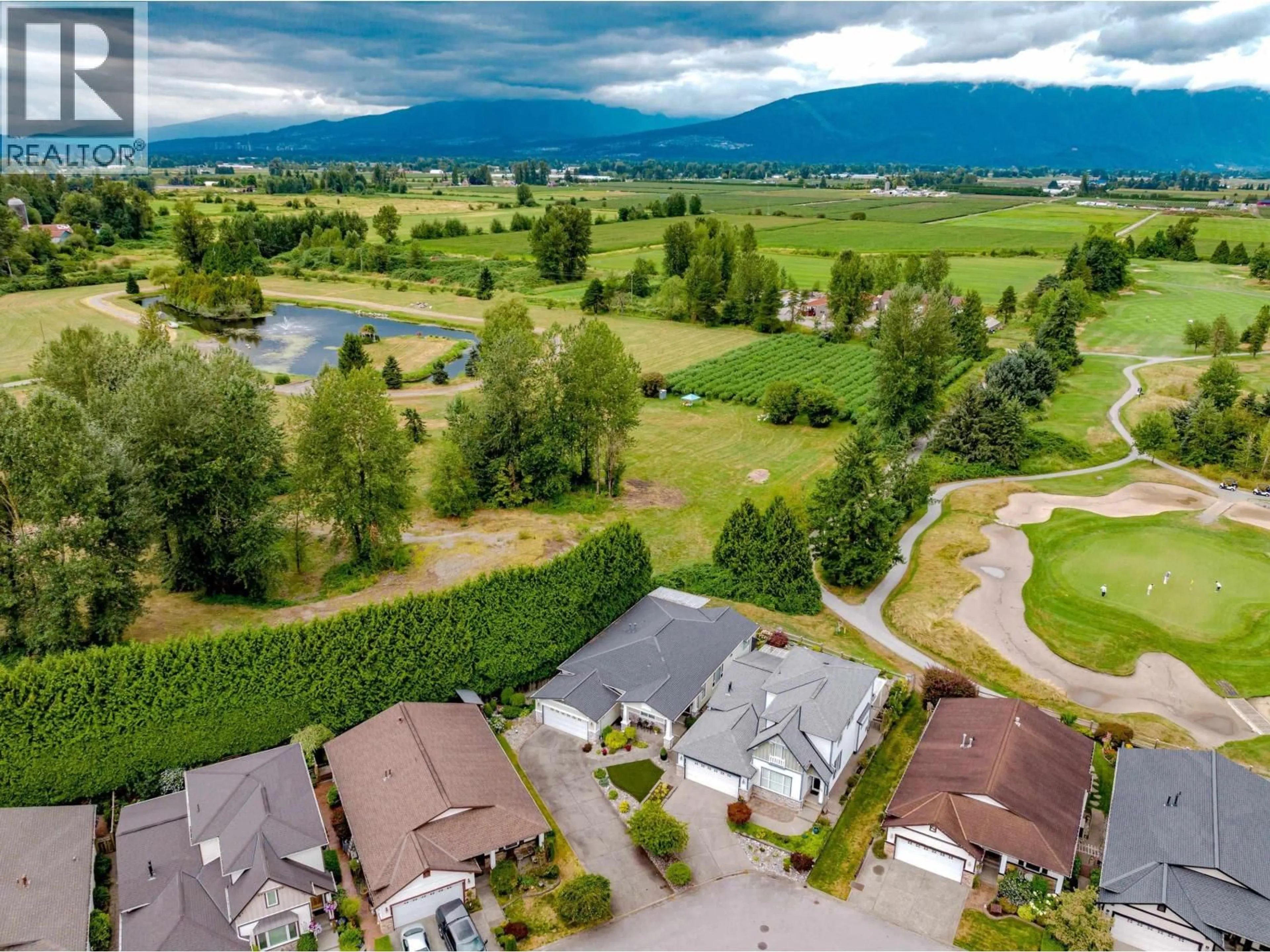 A pic from outside/outdoor area/front of a property/back of a property/a pic from drone, mountain view for 134 - 19639 MEADOW GARDENS WAY, Pitt Meadows British Columbia V3Y2T5