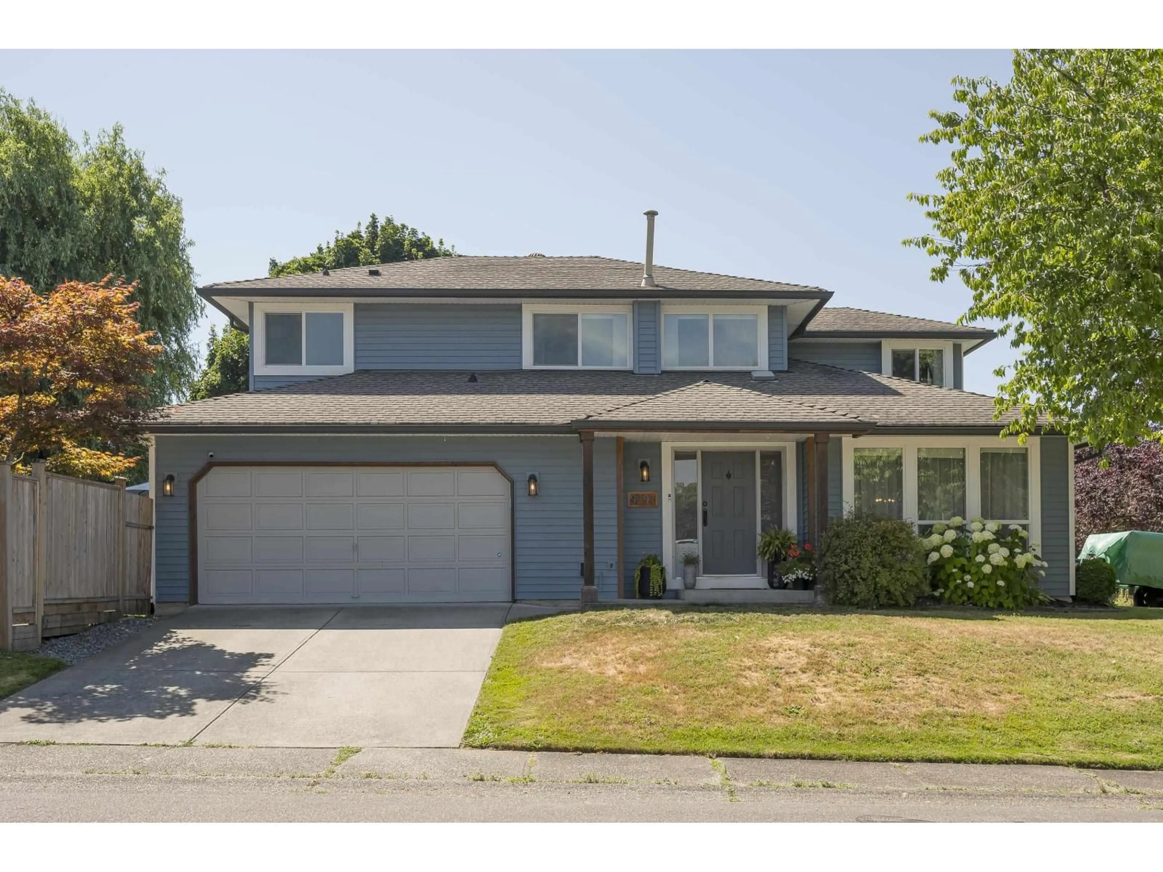Home with vinyl exterior material, street for 9297 211, Langley British Columbia V1M2B2