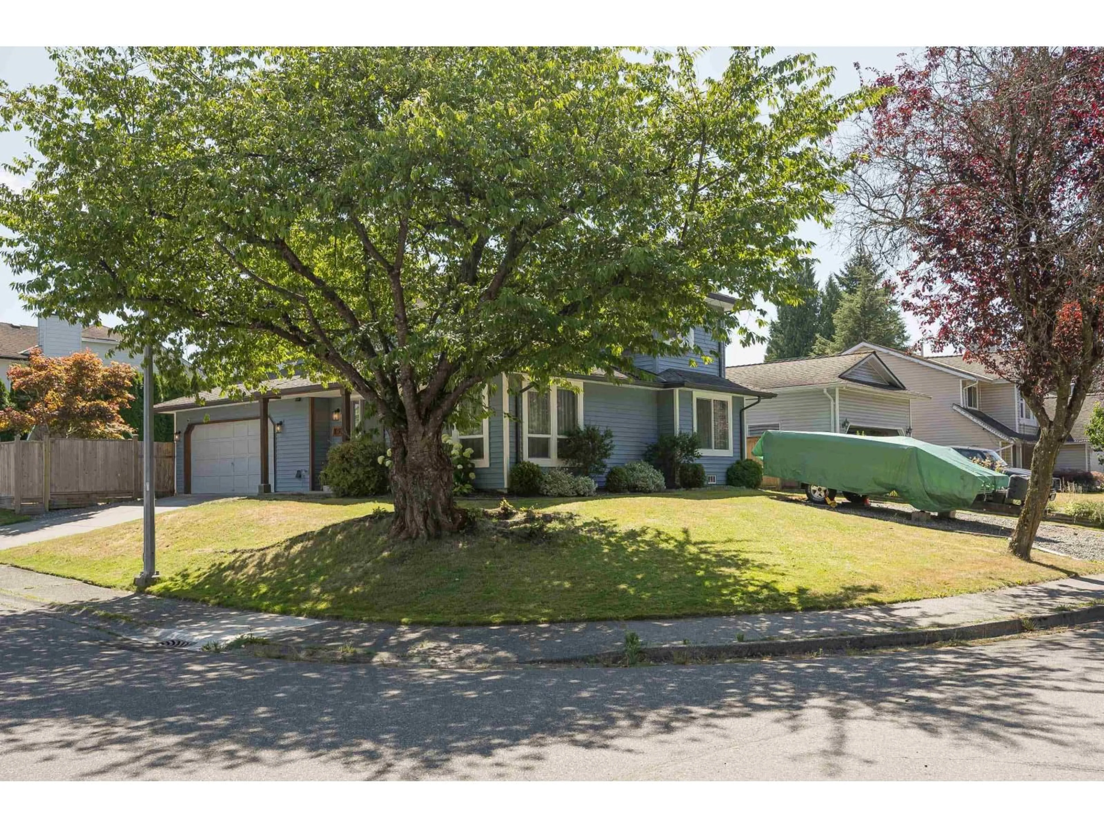 Home with vinyl exterior material, street for 9297 211, Langley British Columbia V1M2B2