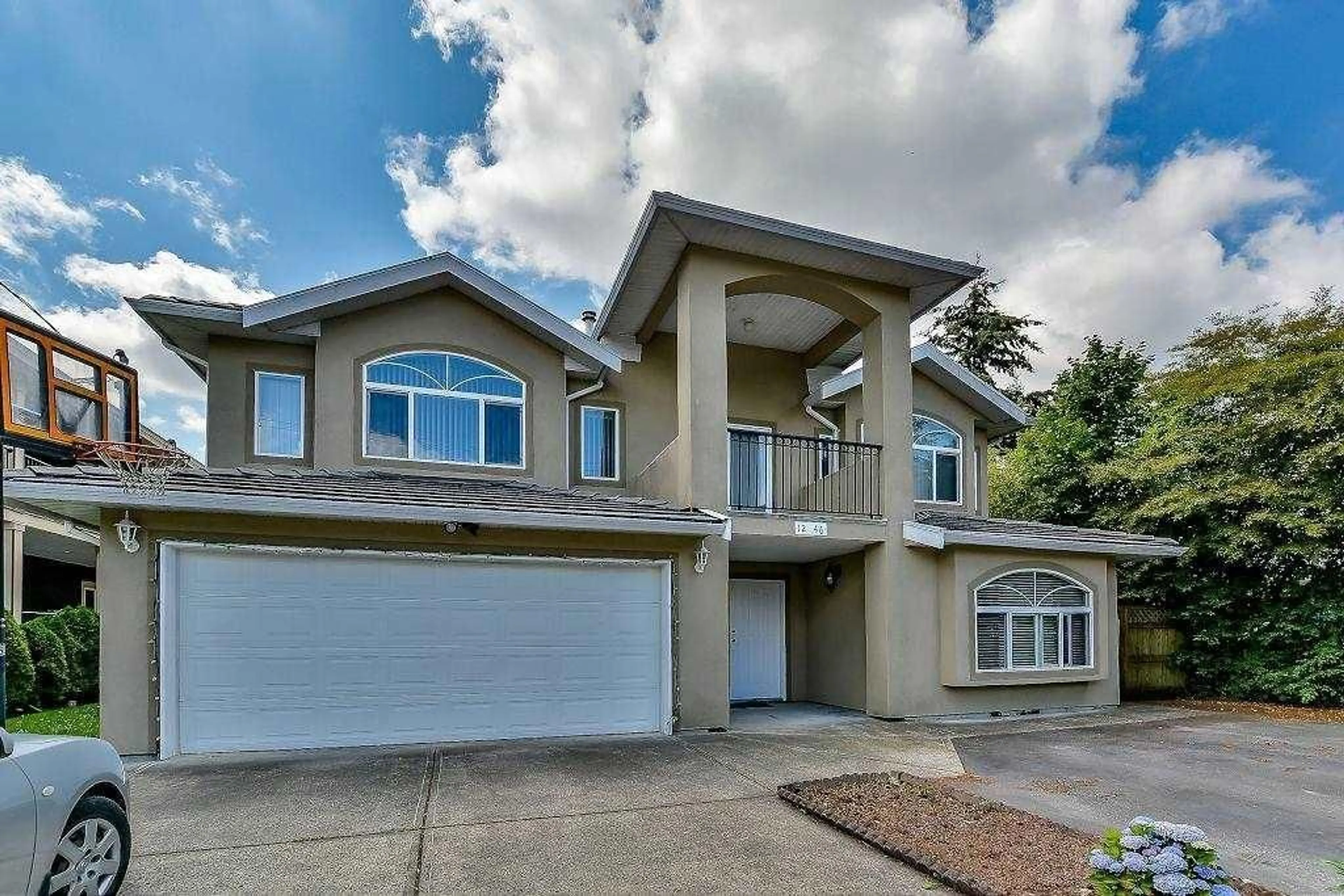 Home with vinyl exterior material, street for 12046 84, Surrey British Columbia V3W3G3