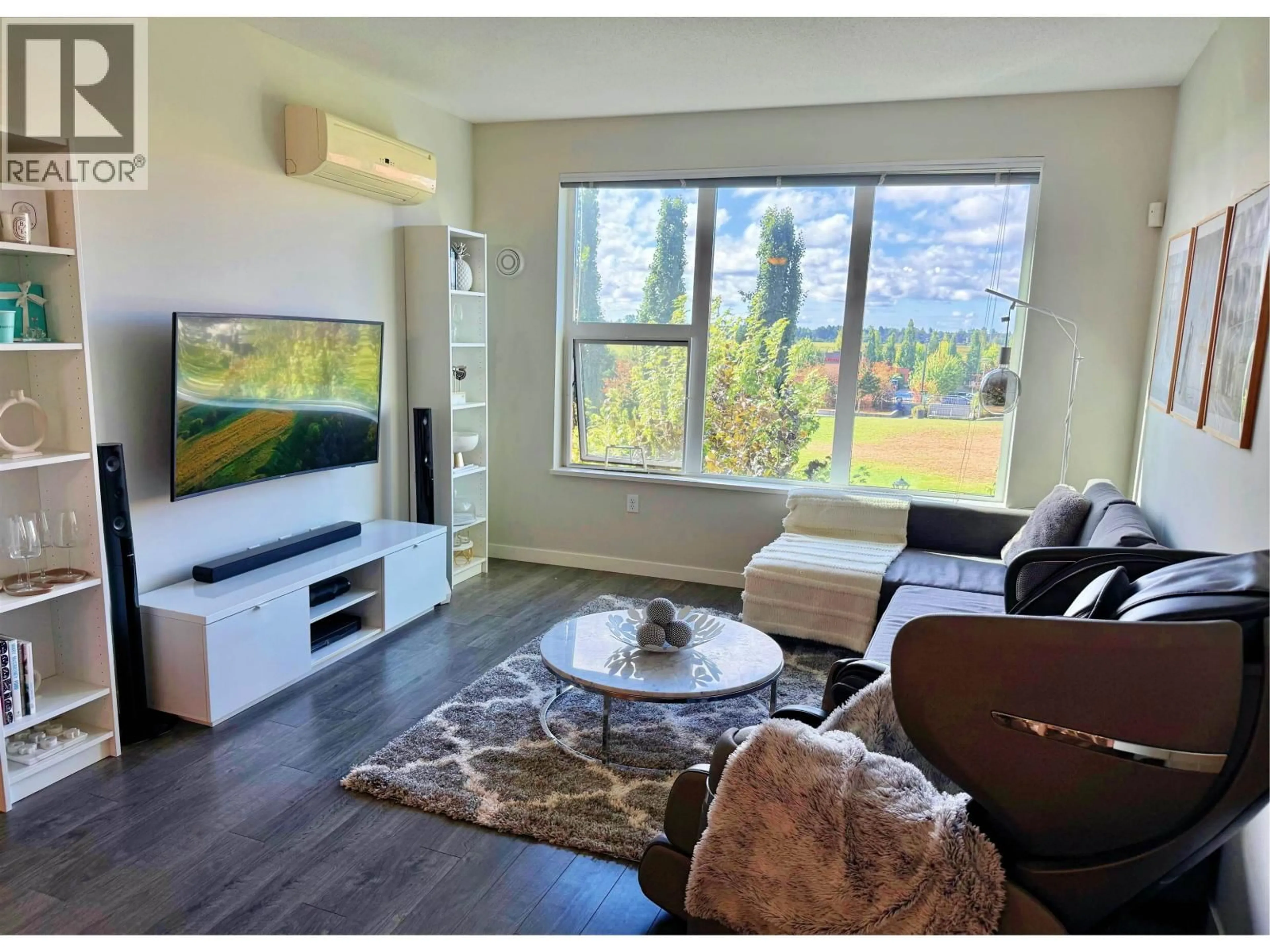 Living room with furniture, wood/laminate floor for 303 - 9399 ALEXANDRA ROAD, Richmond British Columbia V6X0L7