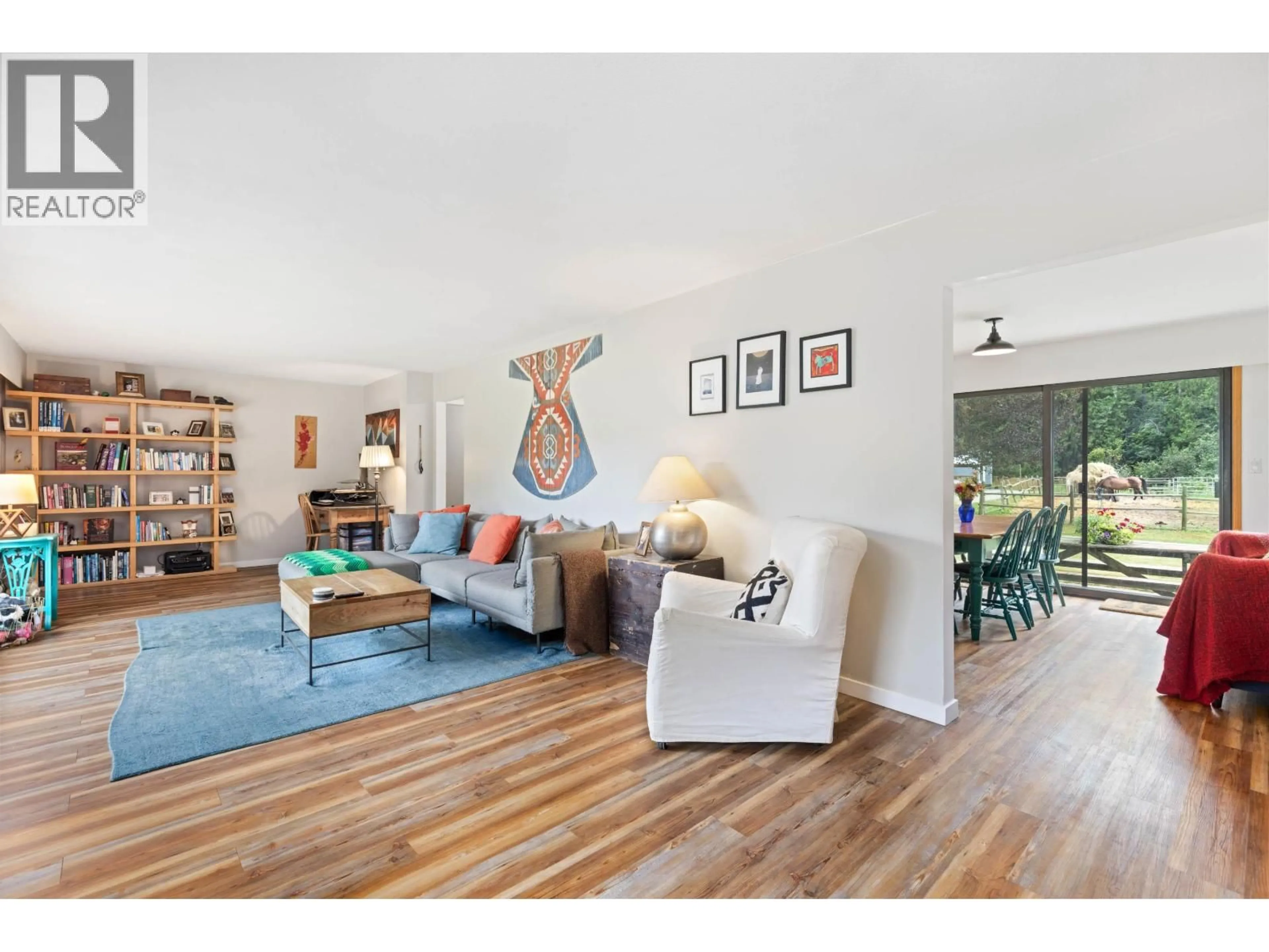 Living room with furniture, wood/laminate floor for 8988B PEMBERTON MEADOWS ROAD, Pemberton British Columbia V0N2L2