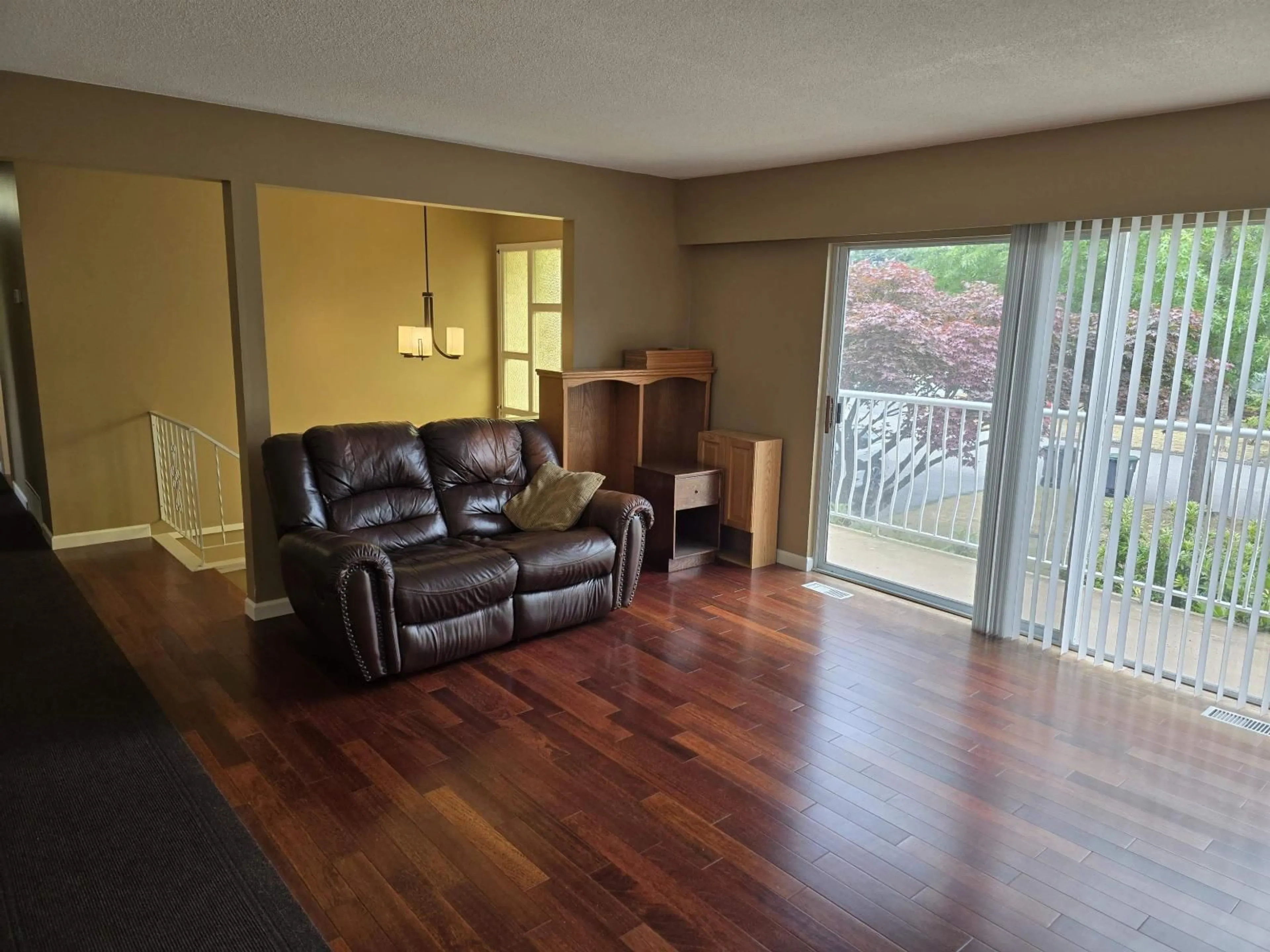 Living room with furniture, wood/laminate floor for 14614 106TH, Surrey British Columbia V3R5Y1