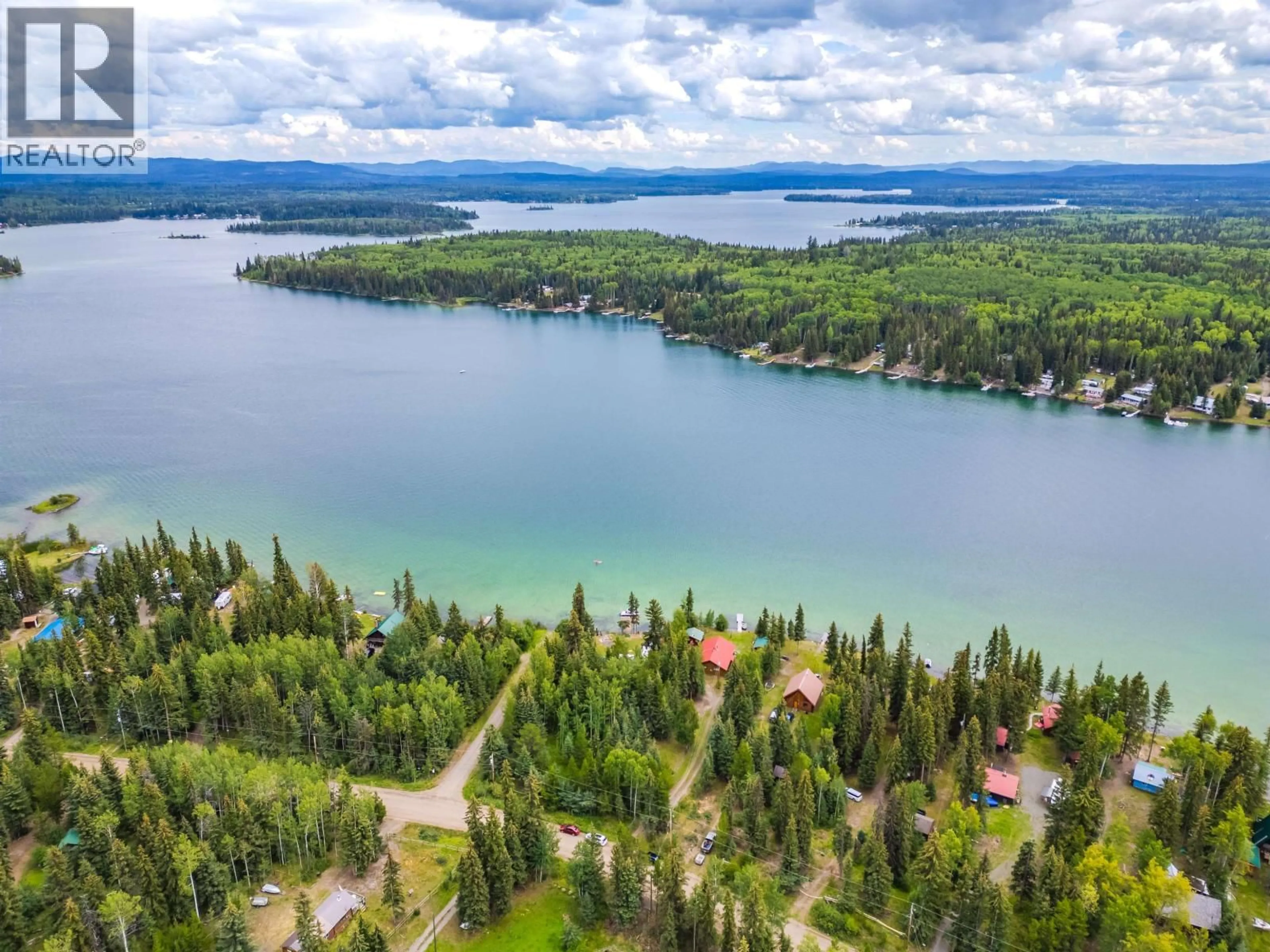 A pic from outside/outdoor area/front of a property/back of a property/a pic from drone, water/lake/river/ocean view for 7213 NATH ROAD, Bridge Lake British Columbia V0K1X1