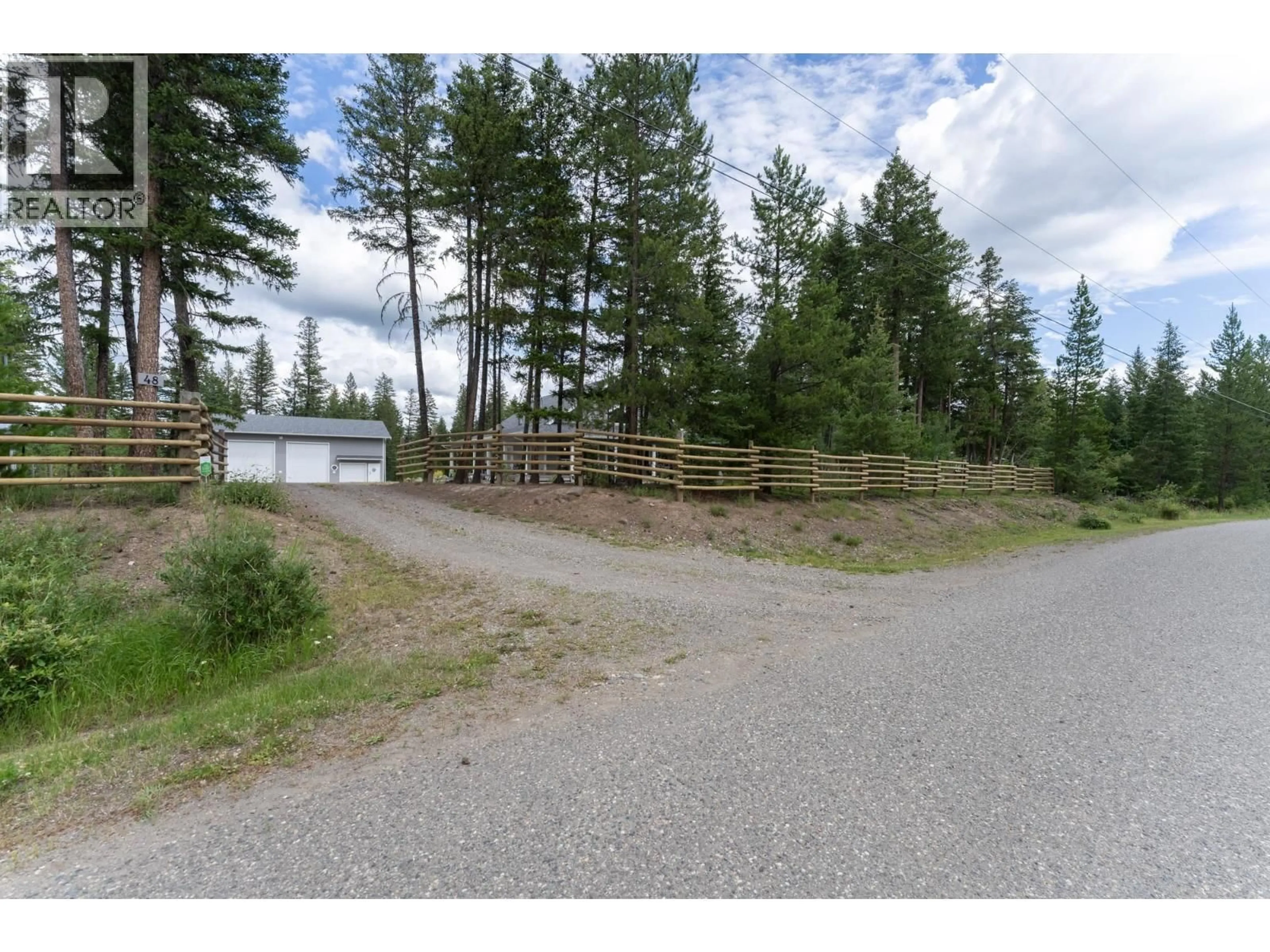 A pic from outside/outdoor area/front of a property/back of a property/a pic from drone, unknown for 48 PTARMIGAN PLACE, 150 Mile House British Columbia V0K2G0