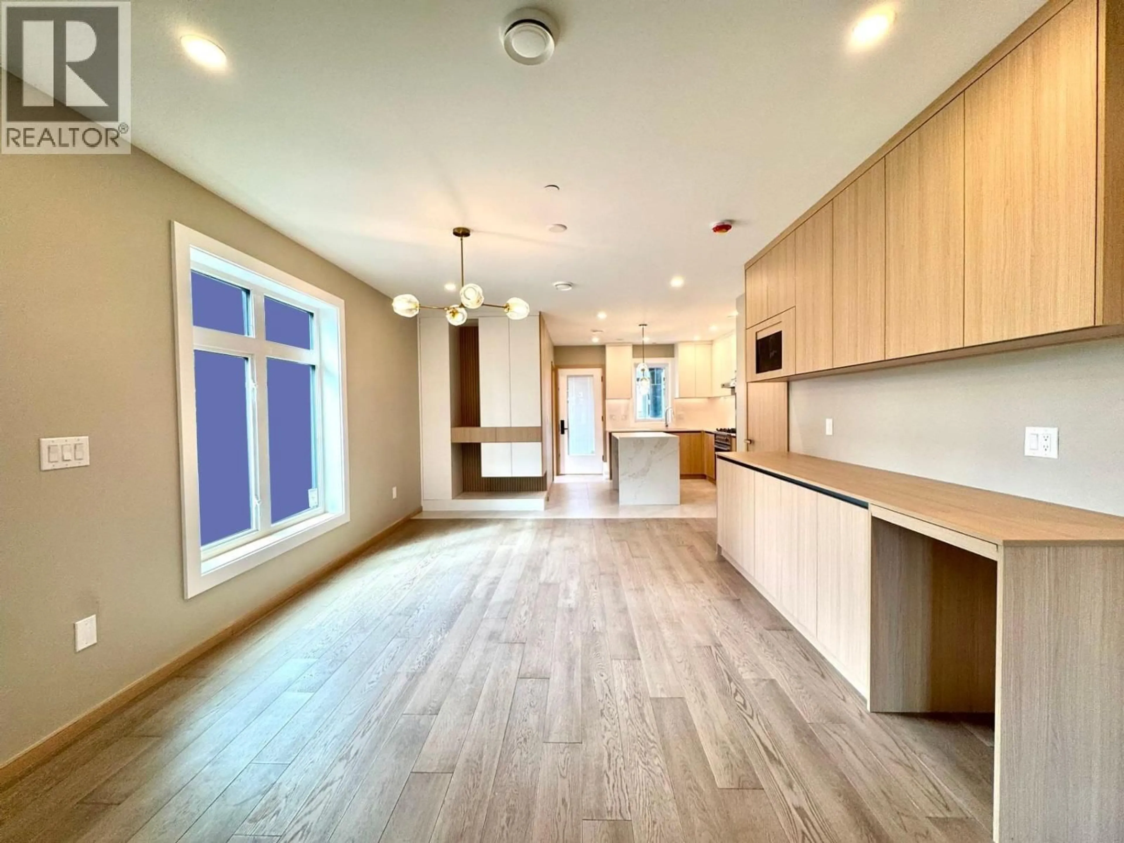Open concept kitchen, wood/laminate floor for 5216 RUPERT STREET, Vancouver British Columbia V5R2J9