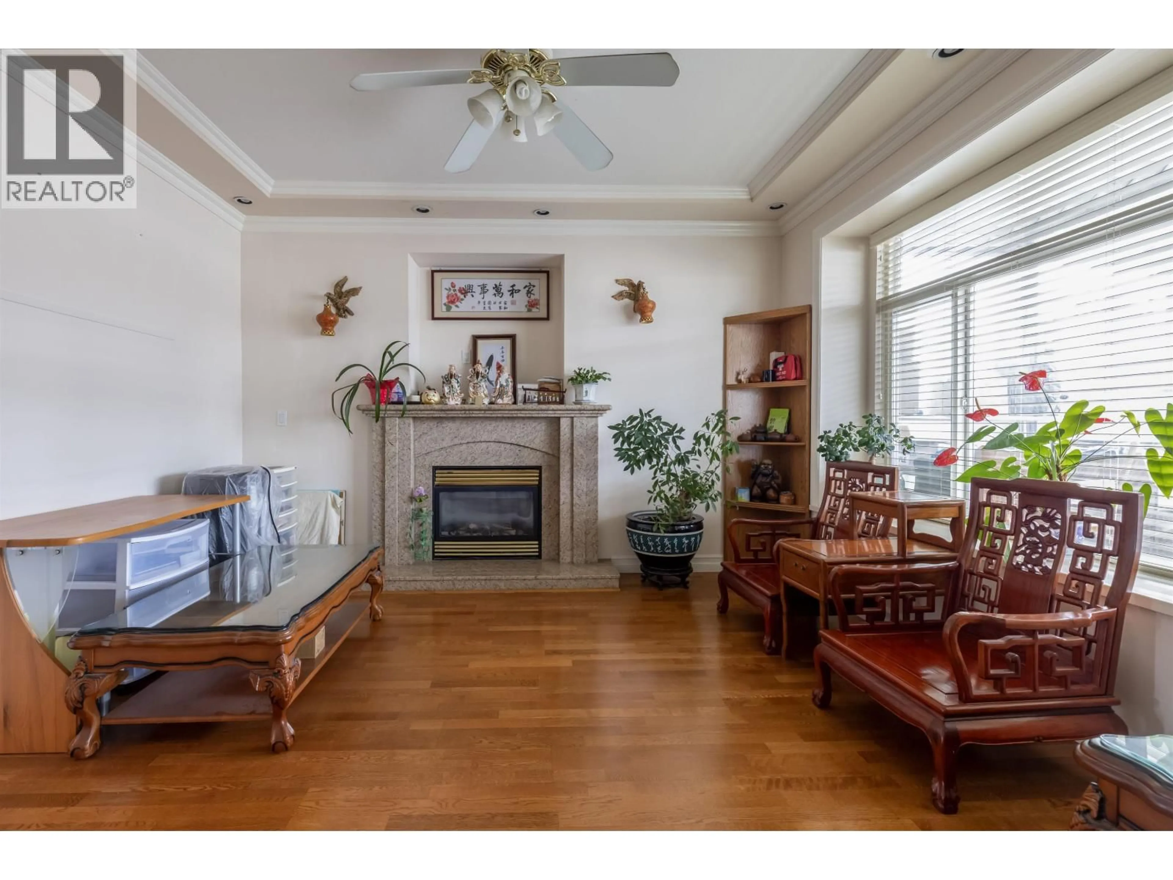 Living room with furniture, wood/laminate floor for 2034 38TH AVENUE, Vancouver British Columbia V5P1G8