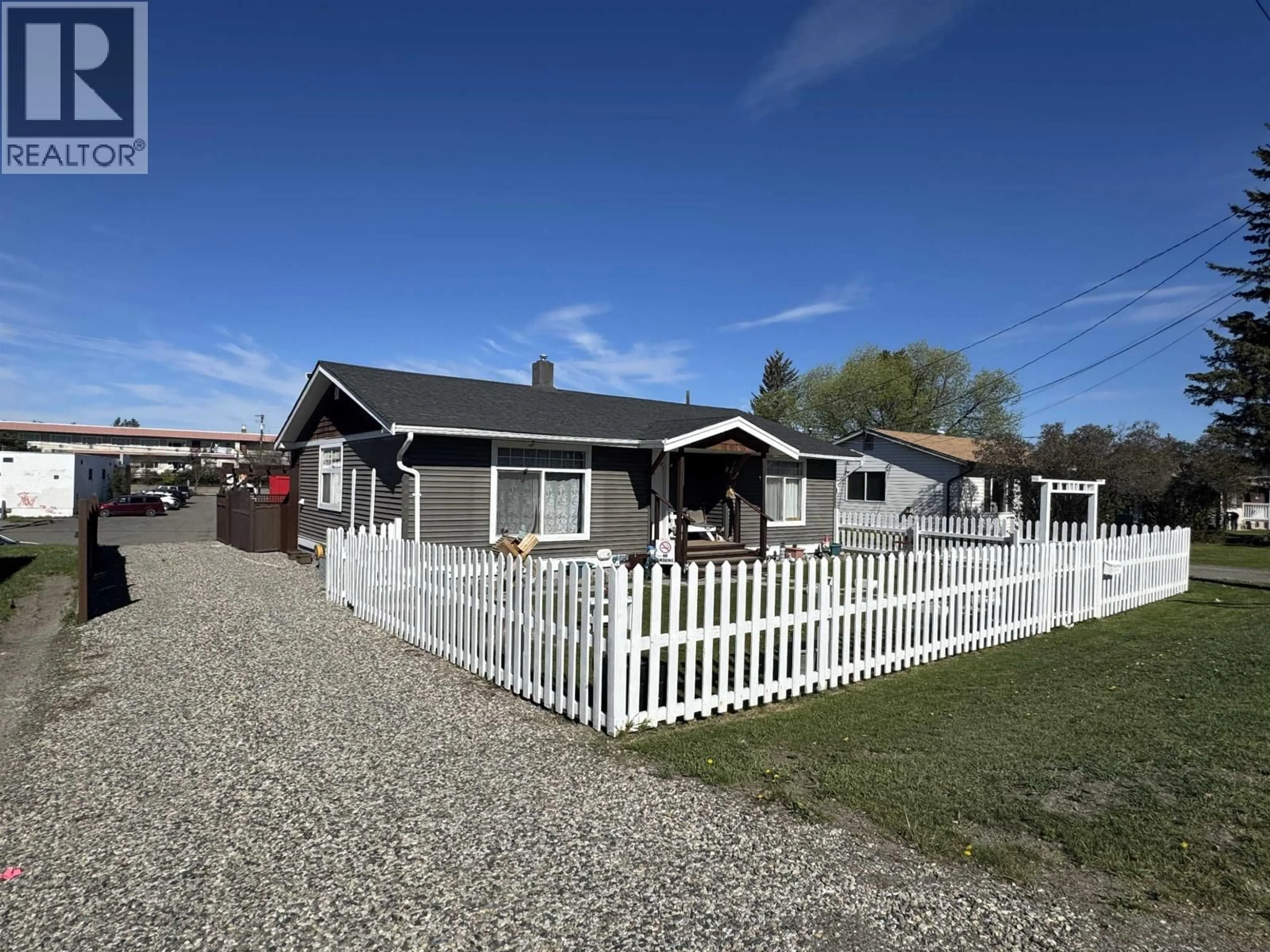 A pic from outside/outdoor area/front of a property/back of a property/a pic from drone, street for 360 CEDAR AVENUE, 100 Mile House British Columbia V0K2E0