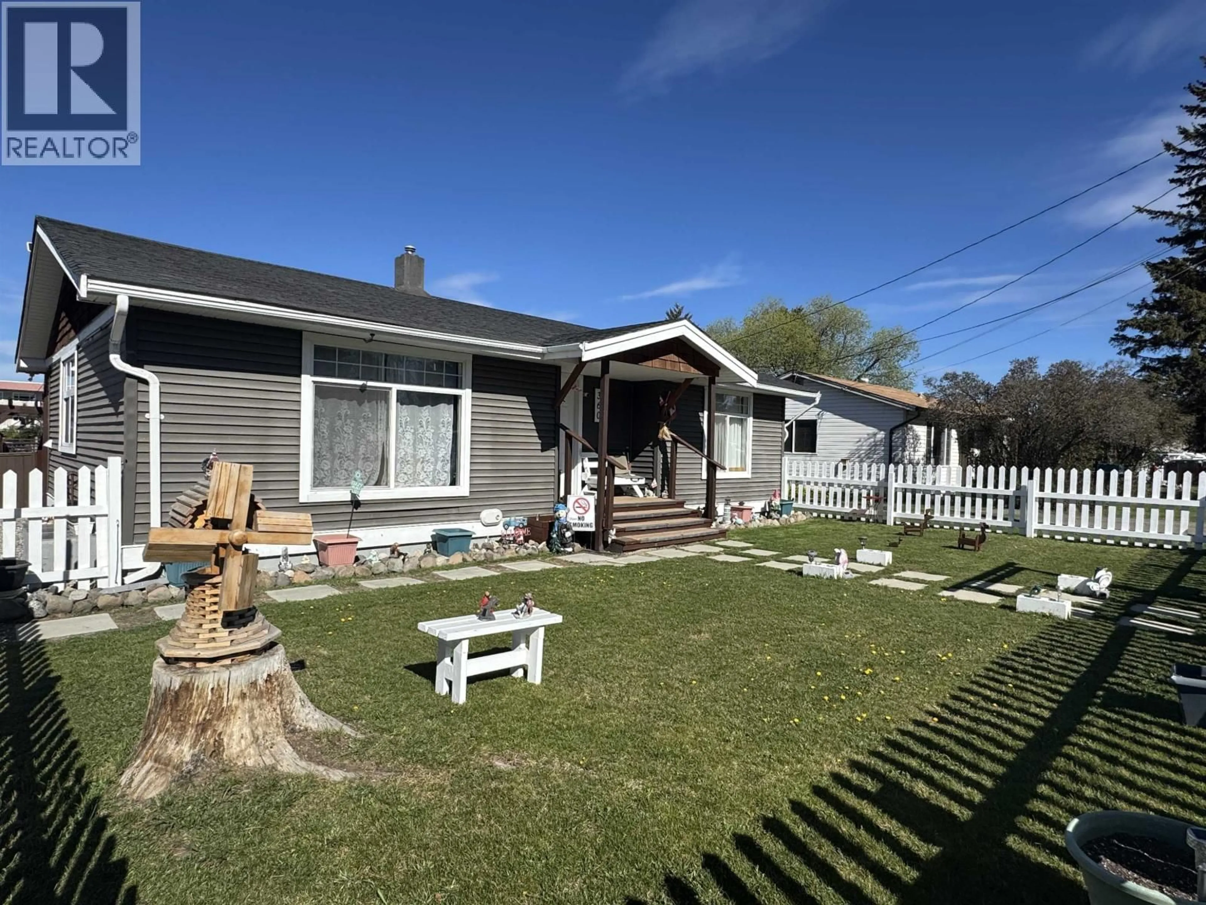 A pic from outside/outdoor area/front of a property/back of a property/a pic from drone, unknown for 360 CEDAR AVENUE, 100 Mile House British Columbia V0K2E0