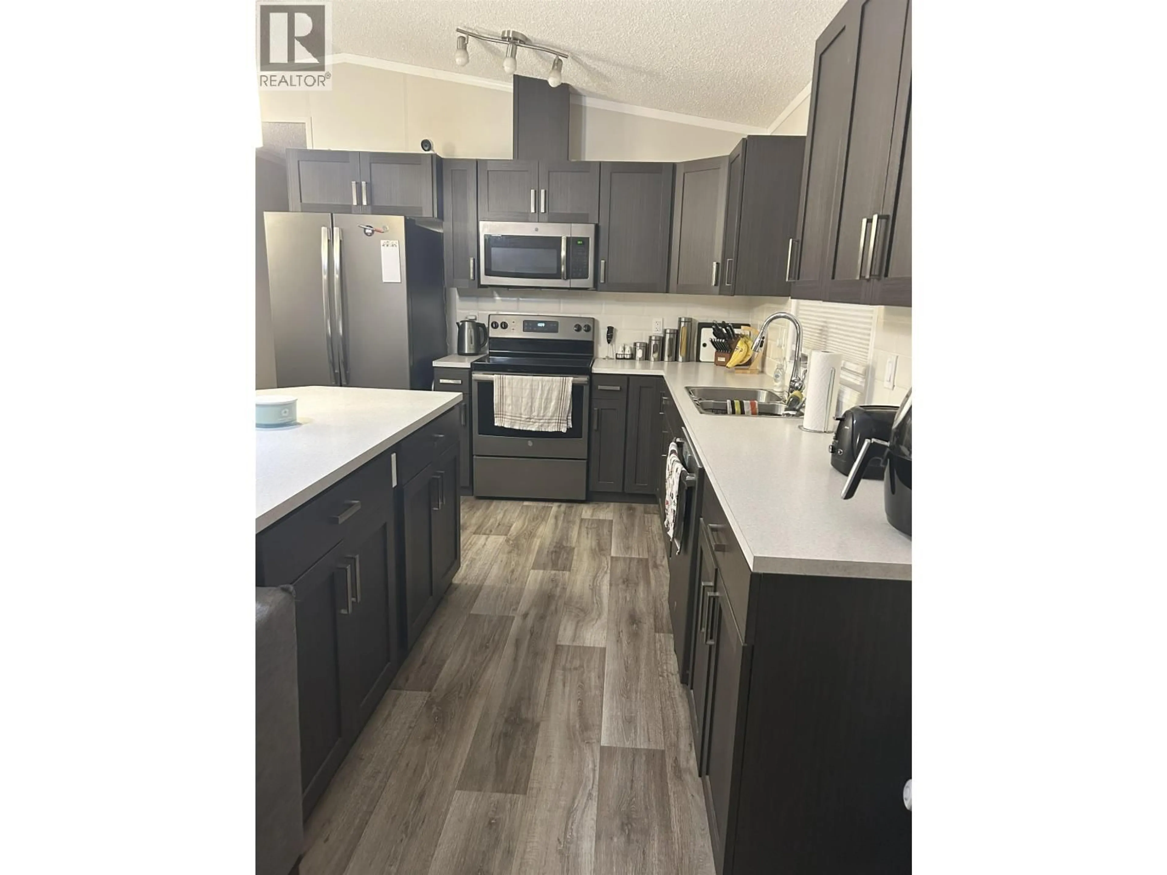 Open concept kitchen, wood/laminate floor for 45 - 5164 HART HIGHWAY, Prince George British Columbia V2K3A1