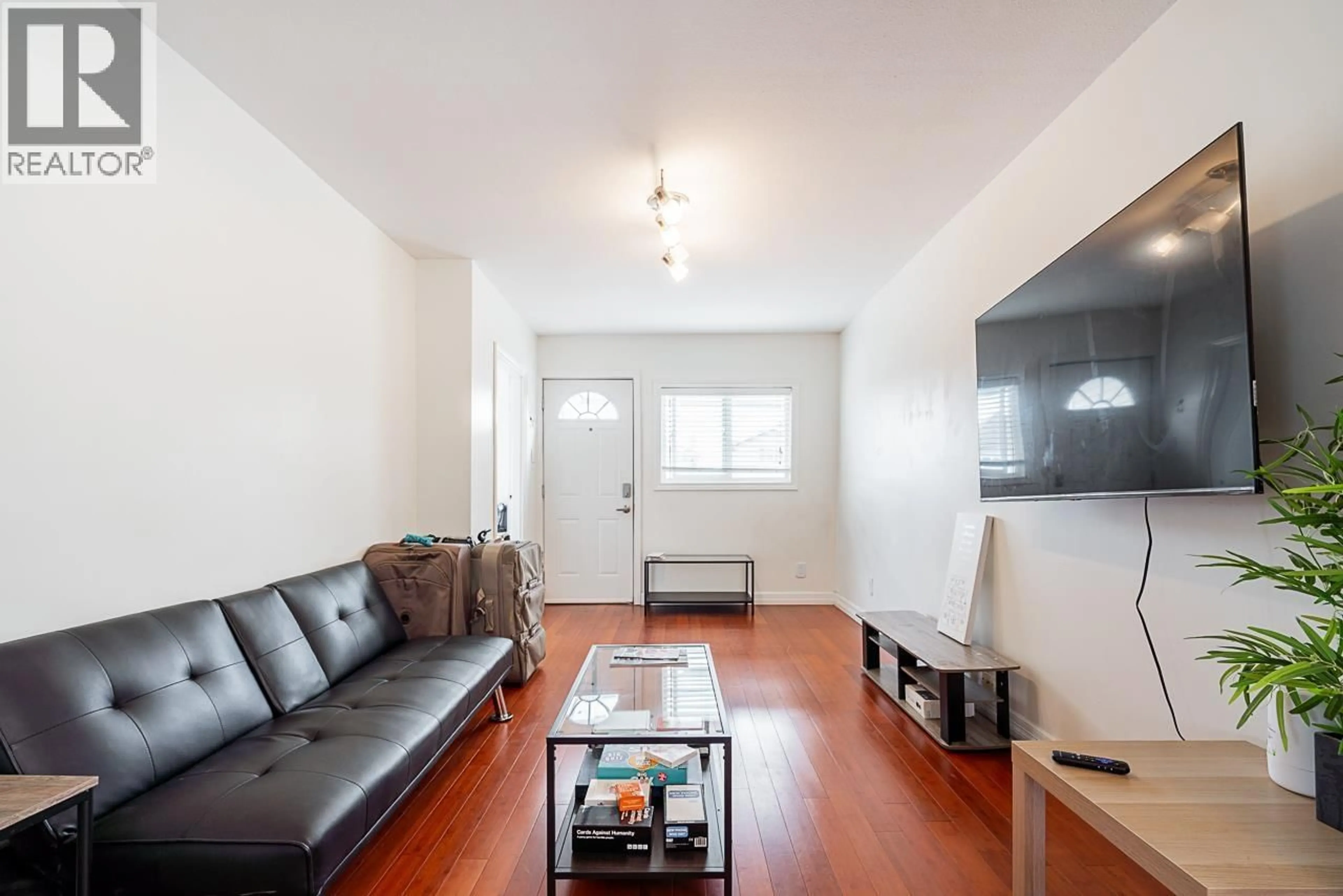 Living room with furniture, wood/laminate floor for 5959 MCMURRAY AVENUE, Burnaby British Columbia V5H3E5