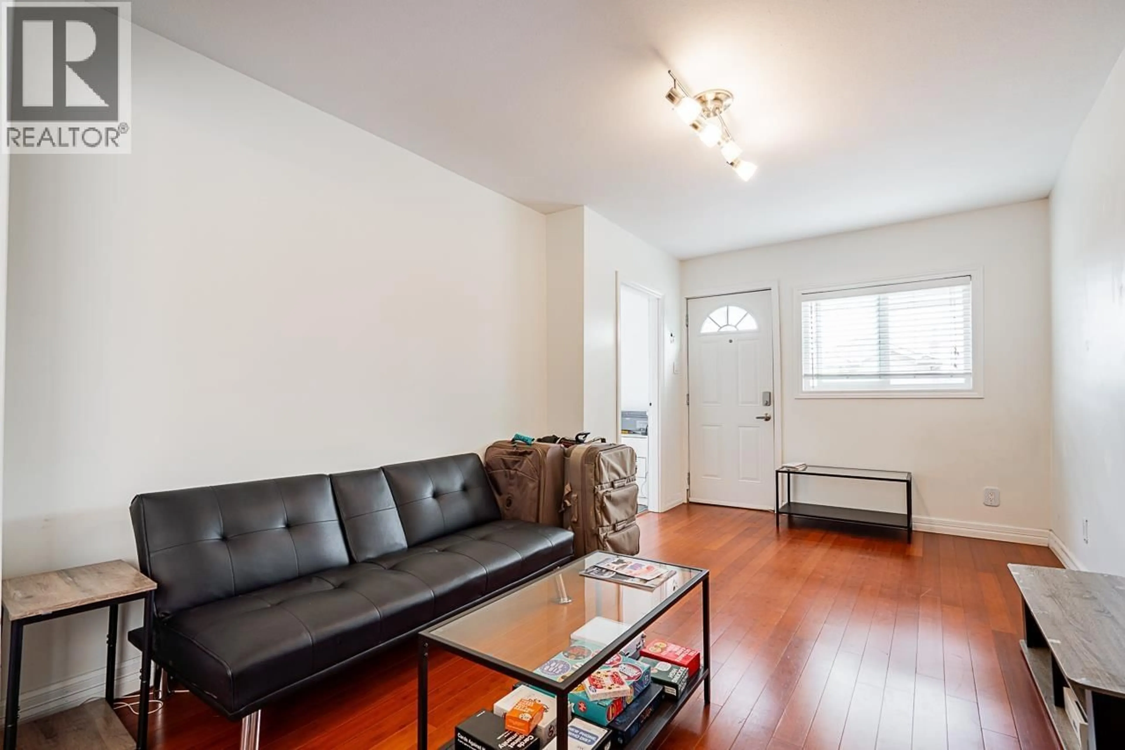 Living room with furniture, wood/laminate floor for 5959 MCMURRAY AVENUE, Burnaby British Columbia V5H3E5
